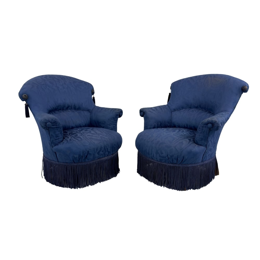 FRINGED FRENCH ARMCHAIRS, A PAIR: Dimensions: H 32.5” x W 31” x D 28” x SH 15.5”. Pair of French Napoleon III style toad armchairs upholstered in original blue fabric with fringes.