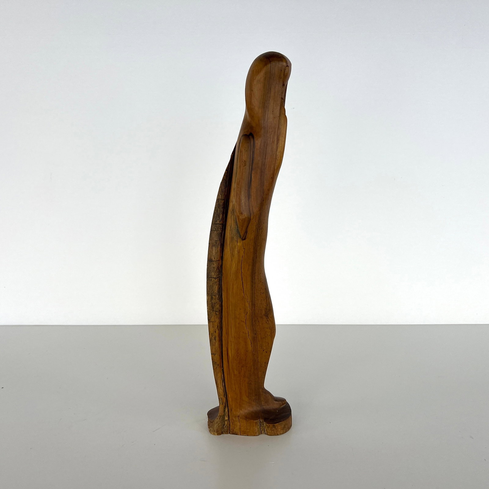 HAND CARVED WOODEN STATUE: Dimensions: H 25” x W 6”. Vintage hand carved wooden statue.