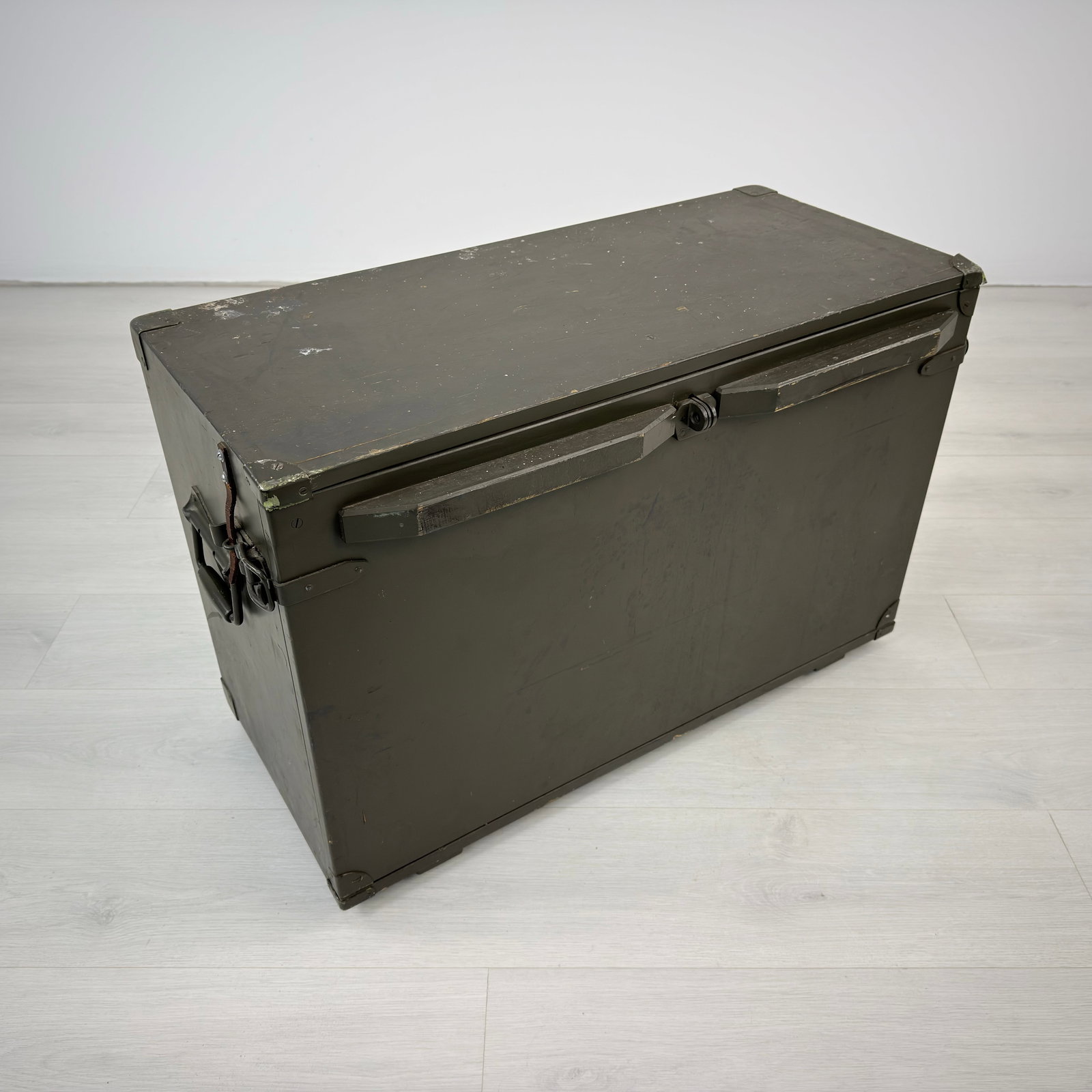 VINTAGE SWISS MILITARY FIELD DESK: Dimensions: H 20.5” x W 30.3” x D 14.5”. Vintage Swiss Military field desk/ storage trunk with shelves inside and metal handles on both size.