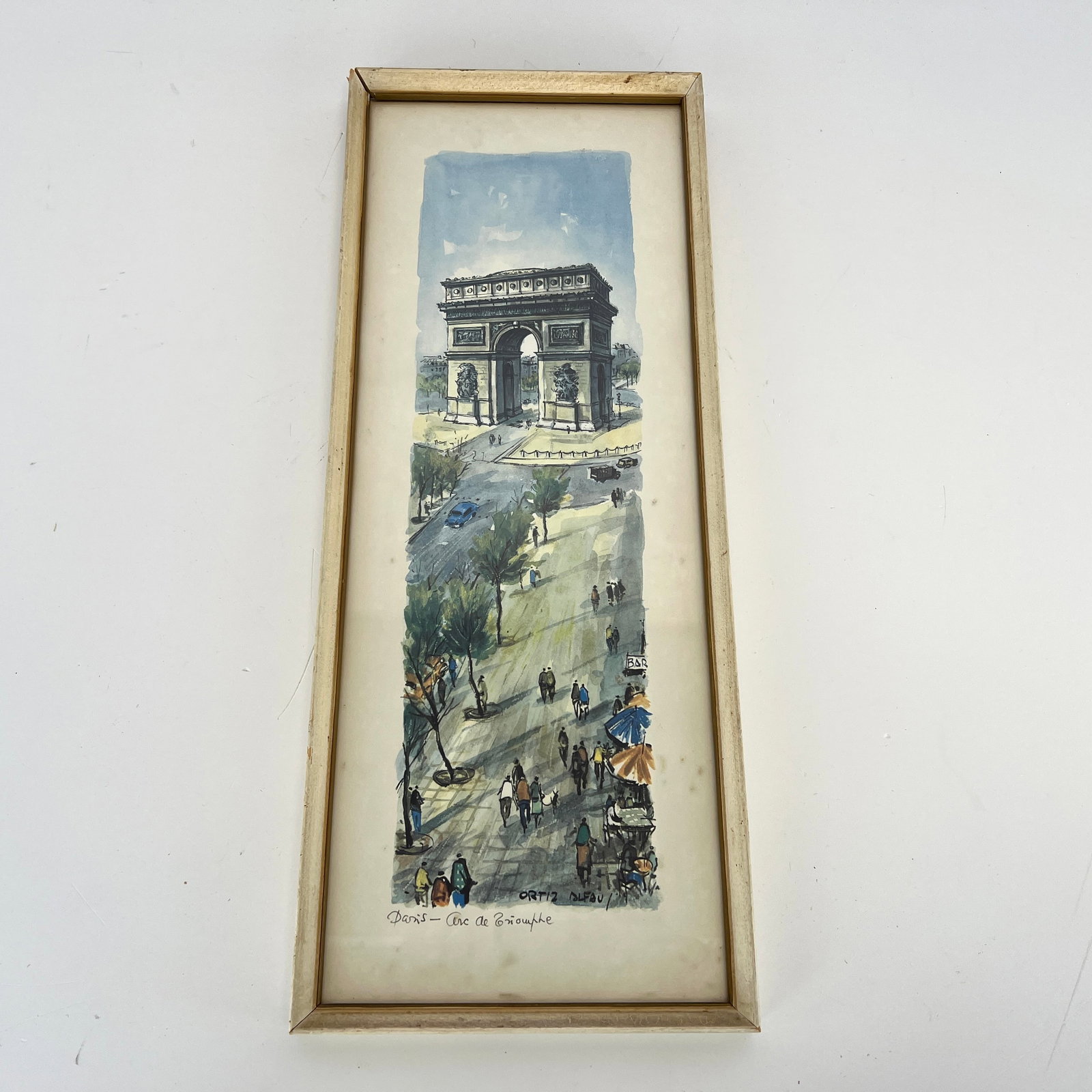 VINTAGE LITHOGRAPH BY ORTIZ ALFAU: Dimensions: H 23” x W 9”. Vintage lithograph by Ortiz Alfau “Paris -Arc de Triomphe with wooden frame and glass on top.