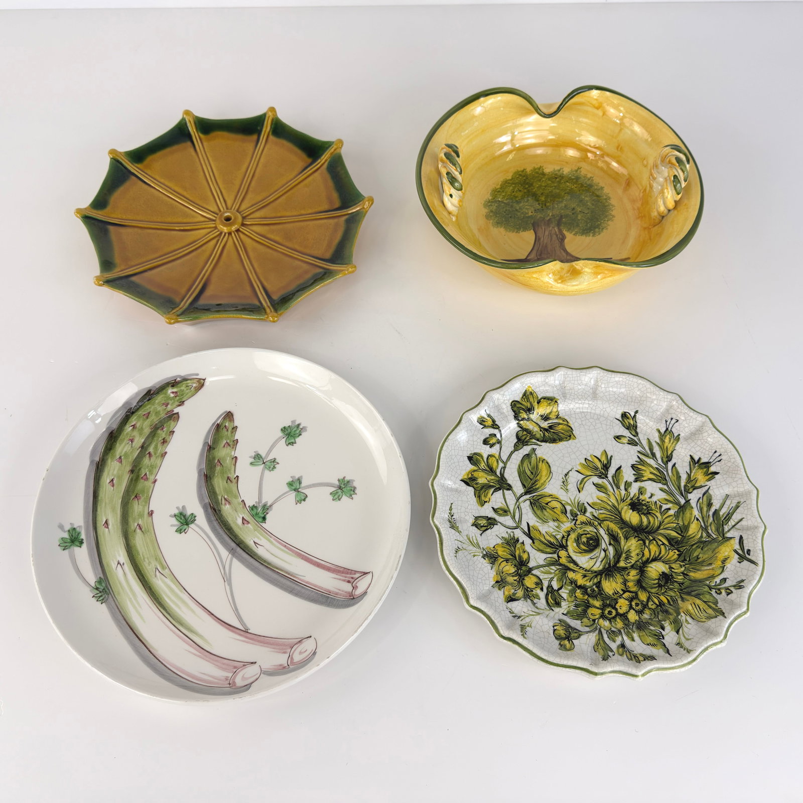 (4) HAND-PAINTED CERAMIC PLATES: Dimensions: W 12”. Set of 4 Italian and French hand-painted ceramic plates. Dimensions: W 10.7”/11”/11.7”.
