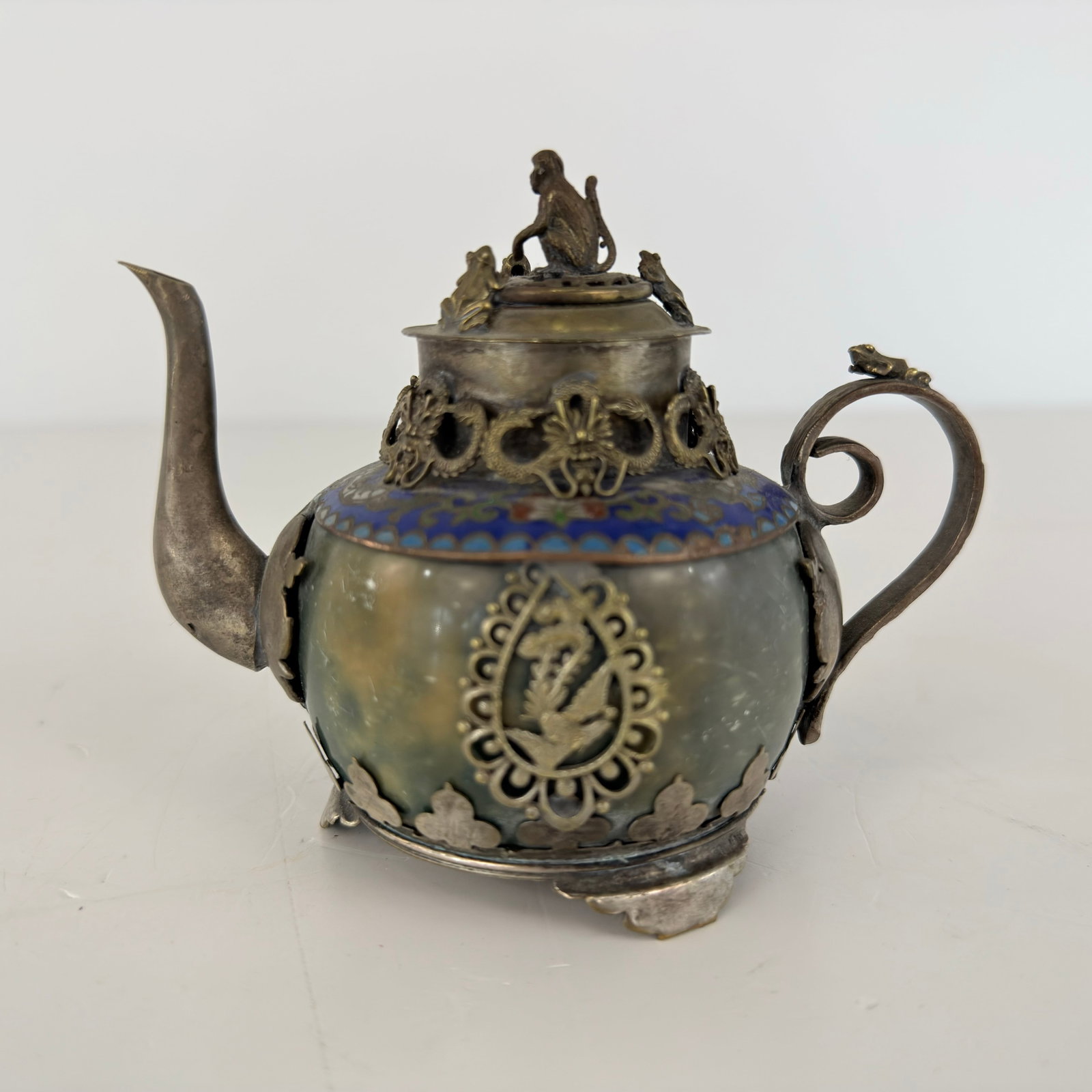 ANTIQUE CHINESE TEAPOT: Dimensions: H 3.7” x W 4.7”. Antique Chinese silver plated teapot with lid.