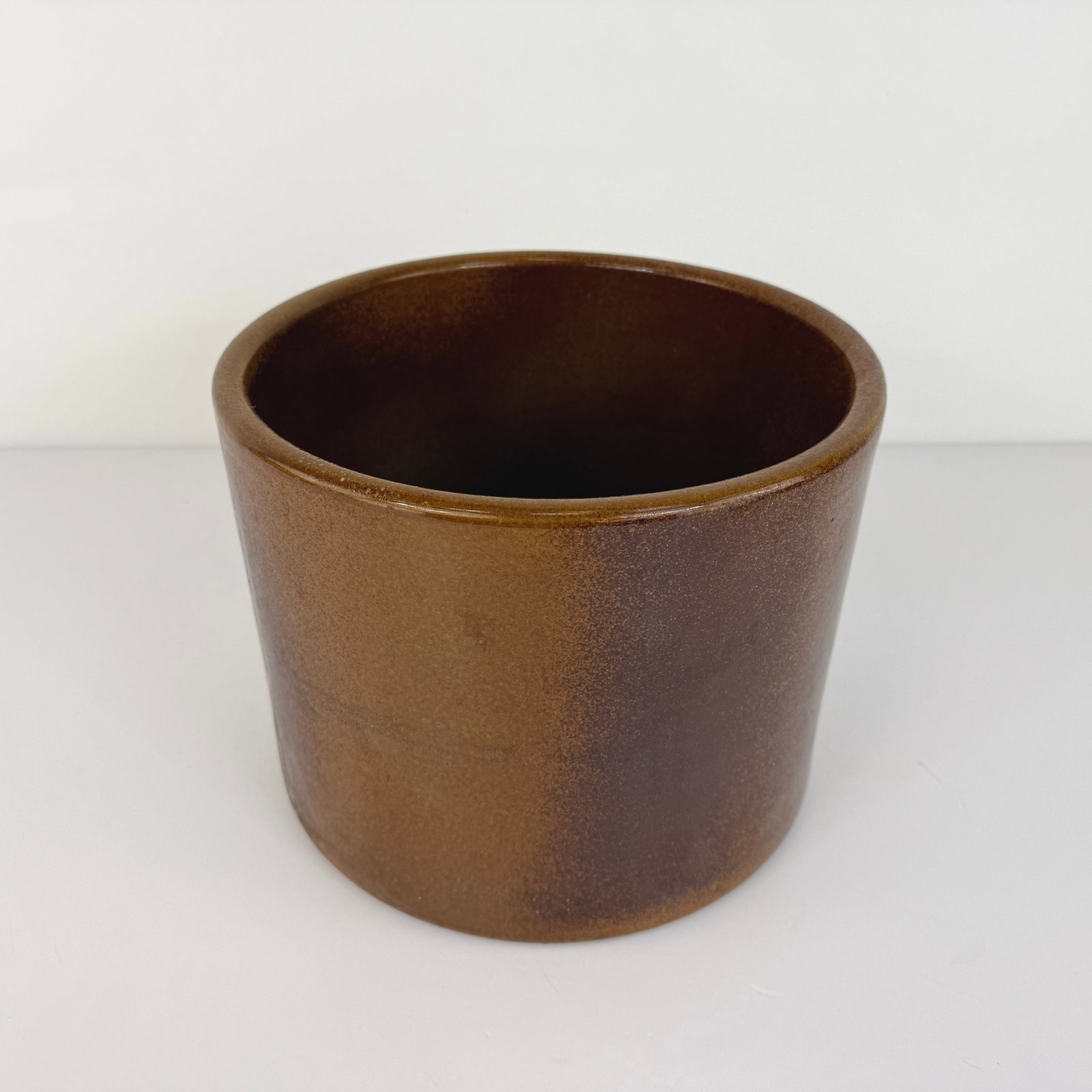 BROWN CERAMIC PLANTER: Dimensions: H 9.5” x W 11”. Antique handmade brown ceramic planter.