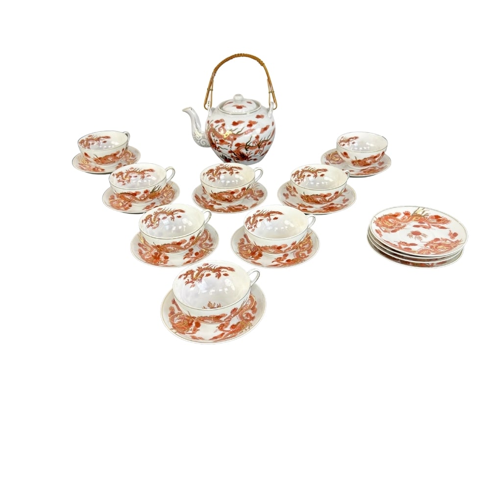 JAPANESE KUTANI STYLE PORCELAIN TEA SET: Dimensions: H 8” x W 7.5”. Antique Japanese Kutani style hand painted with dragon motif porcelain tea set, features 1 teapot, 8 cups with 12 saucers. Dimensions: H (cup) 1.7” x W