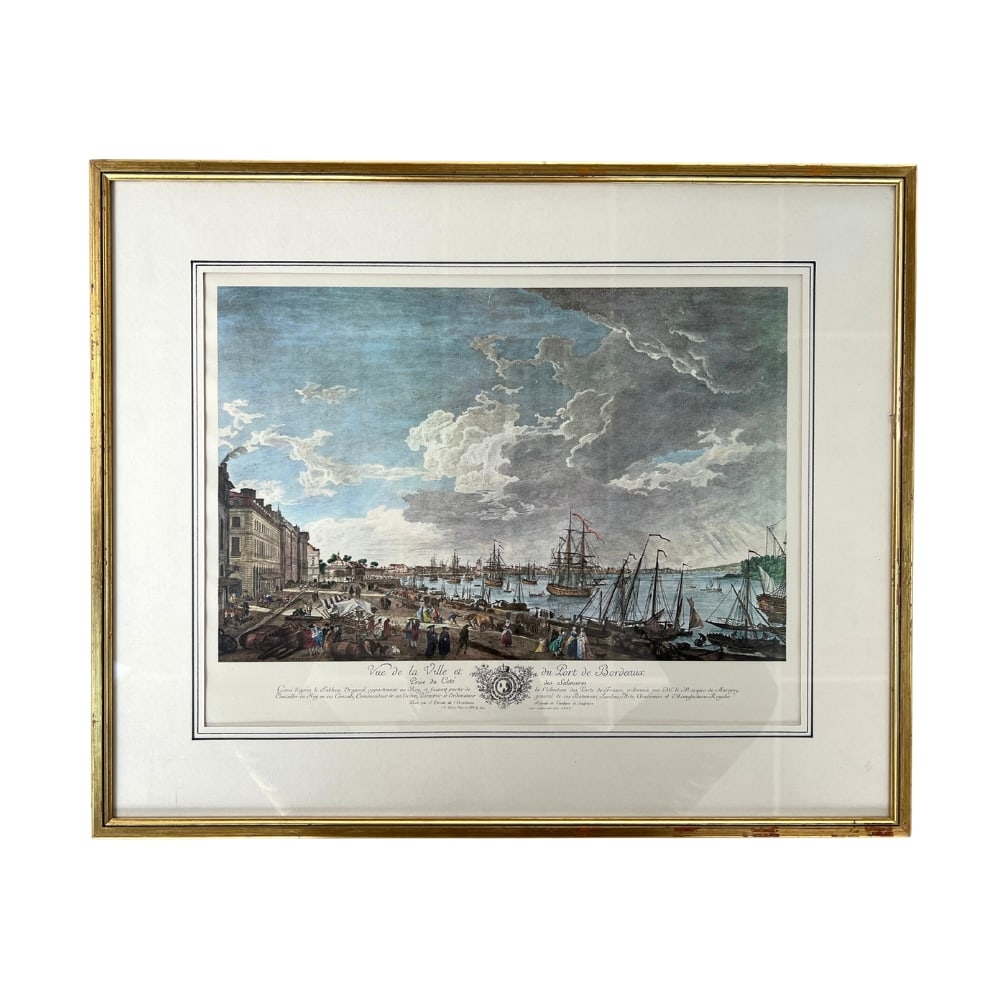 JOSEPH VERNET ENGRAVING: Dimensions: H 18” x W 22”. Joseph Vernet “Vue de la Ville et du Port de Bordeaux” engraving with gilded wood frame.