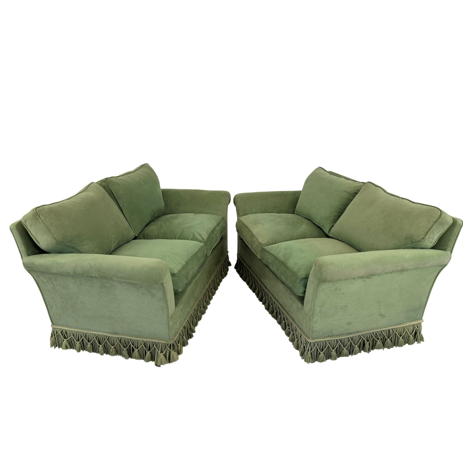FRENCH TWO-SEATER SOFAS, A PAIR: Dimensions: H 30” x W 62” x D 33.5” x SH 23”. Pair of Vintage French two-seater sofas in original green fabric with fringes.