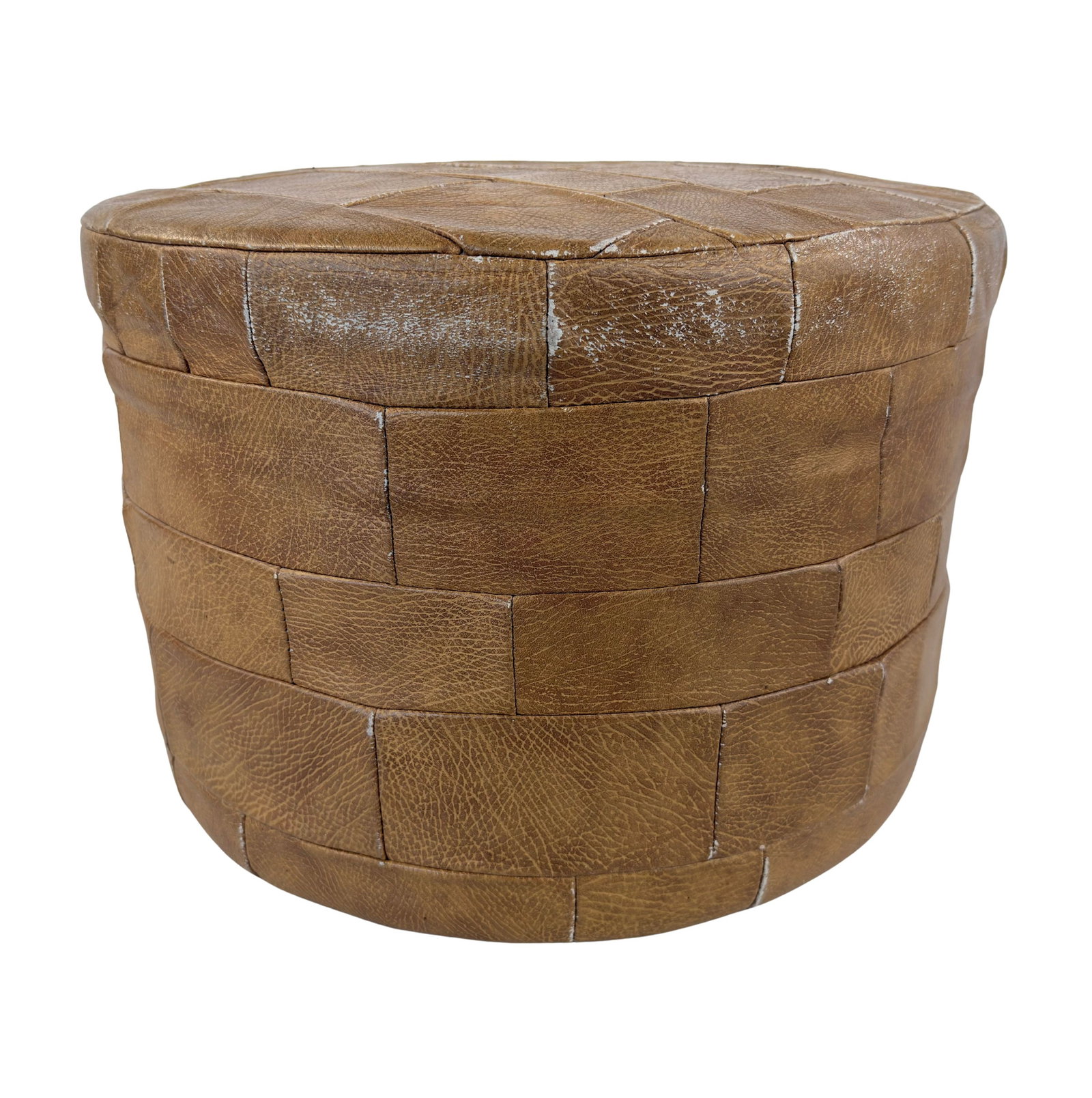 DE SEDE LEATHER POUF: Dimensions: H 12.5” x W 18”. Vintage De Sede brown leather patchwork pouf.