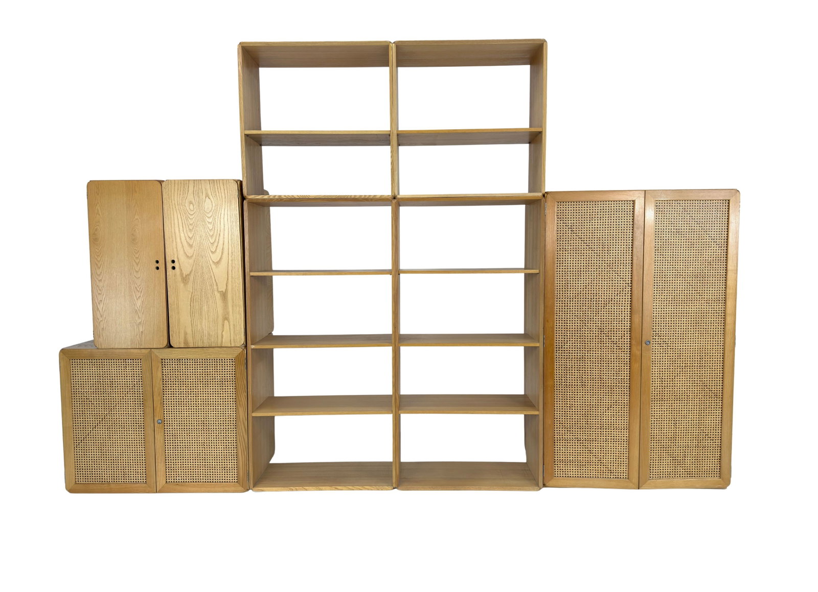 ITALIAN MODULAR WALL CABINET: Dimensions: H 60.5” x W 37.5” x D 22.5”. Vintage Italian modular wall cabinet with multiple shelves and cupboards with rattan doors. Dimensions: small unit with two rattan doors H