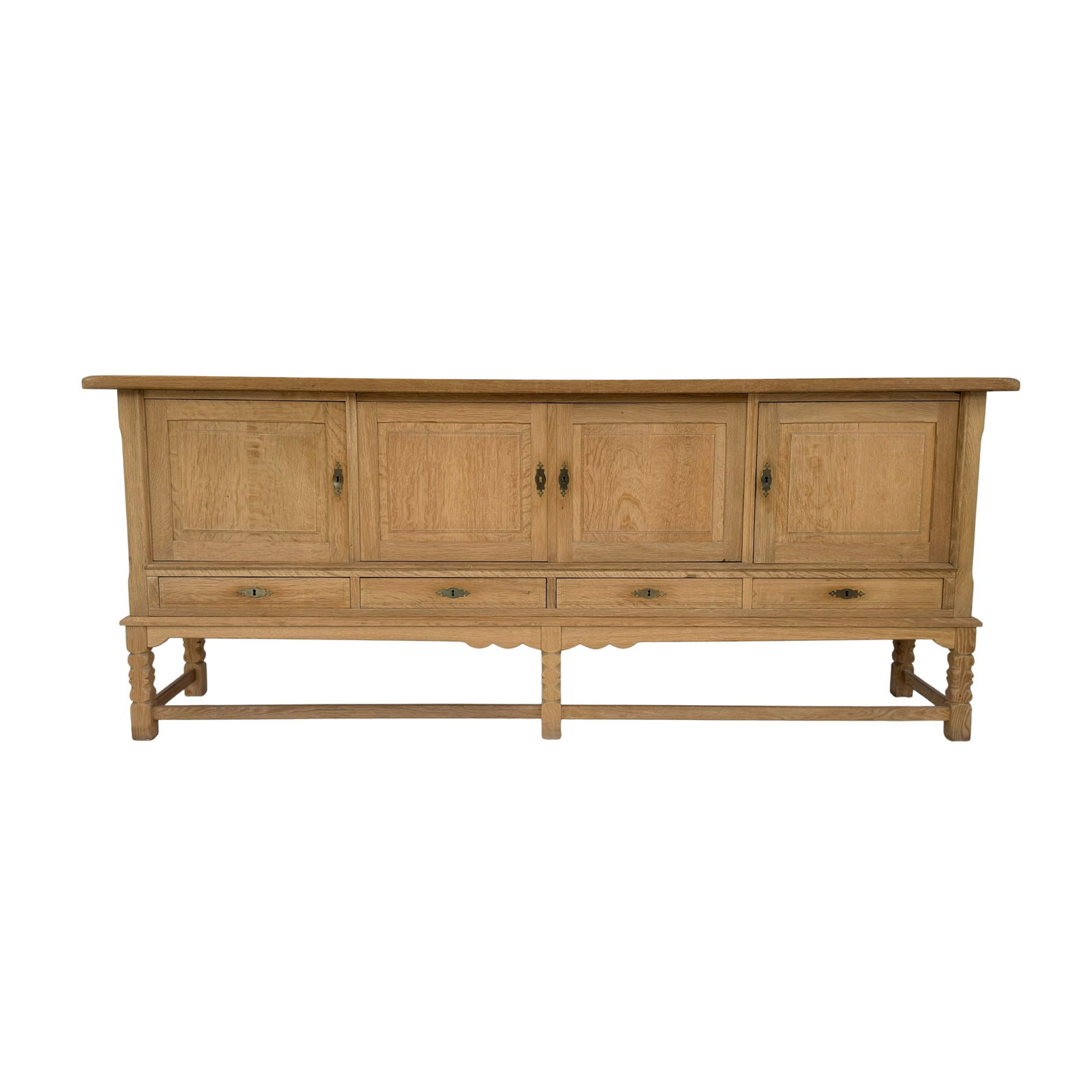 DANISH SIDEBOARD ATTR. TO HENRY KJÆRNULF: Dimensions: H 36” x W 89” x D 19.7”. Vintage Danish oak sideboard attr. to Henry Kjærnulf with 4 small drawers and 3 cupboards, 1960s.