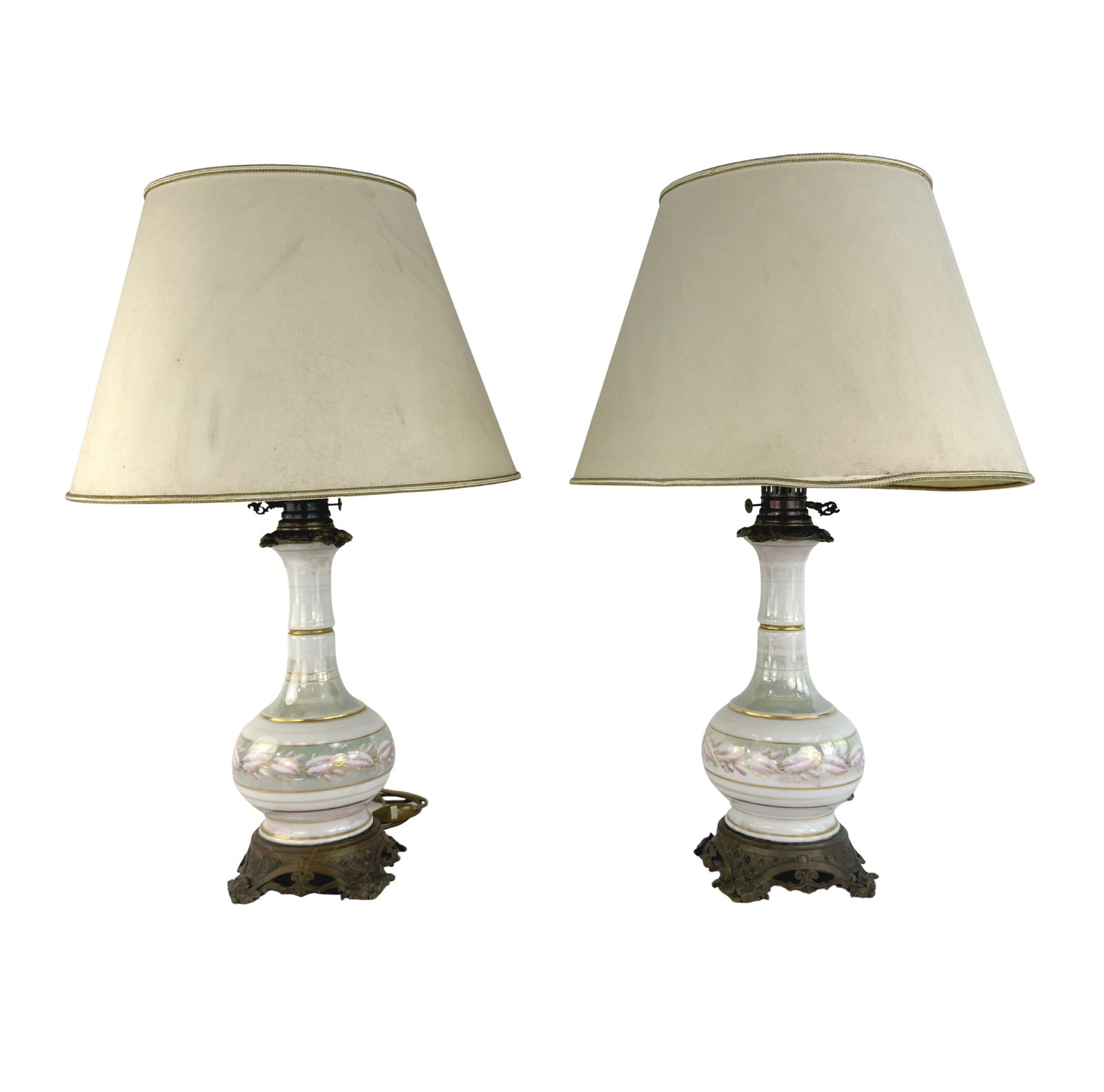 ANTIQUE FRENCH PORCELAIN TABLE LAMPS, A PAIR: Dimensions: H 24.5” x W 7”. Pair of antique French hand painted ceramic table lamps with brass details and fabric lampshades.