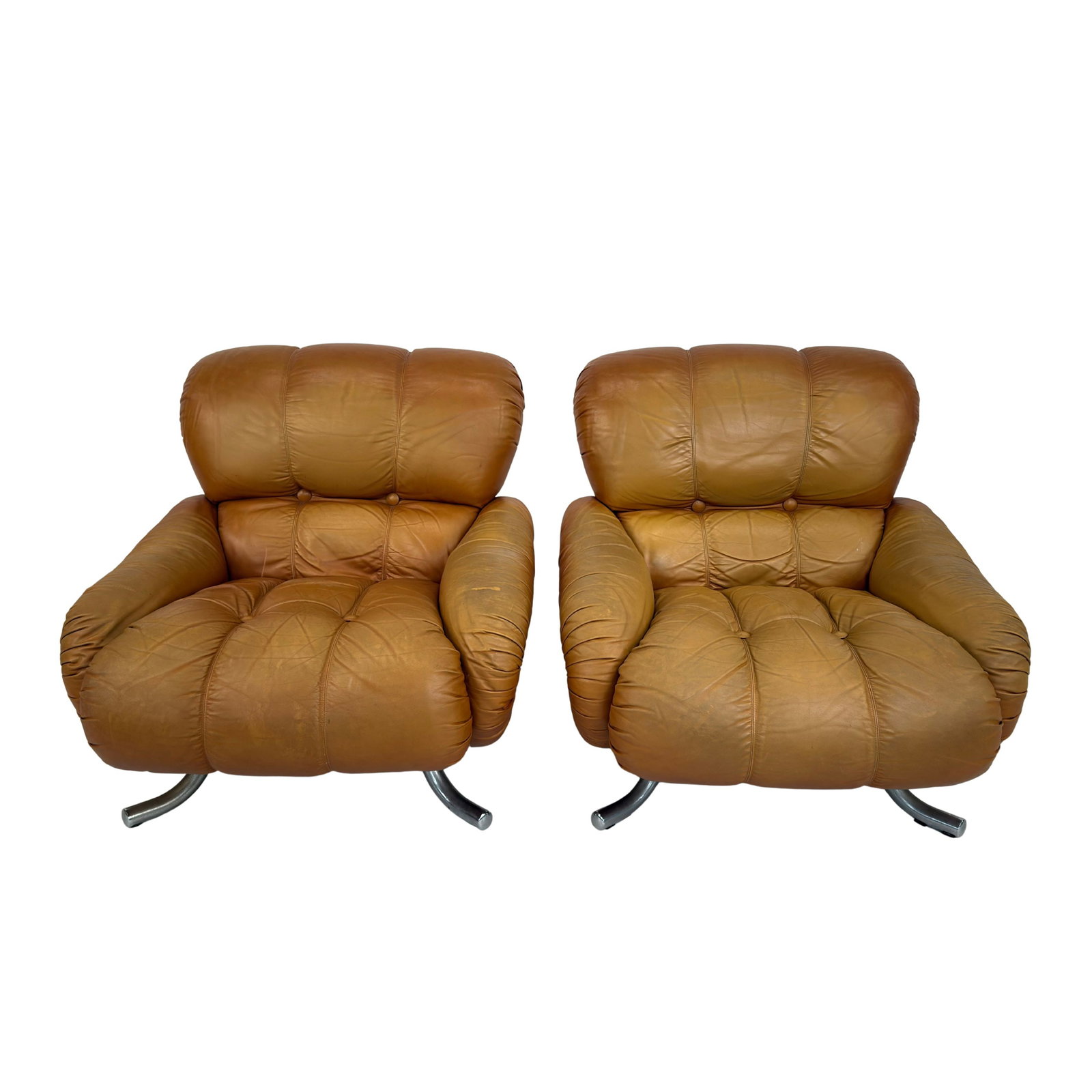 ITALIAN LEATHER LOUNGE CHAIRS, A PAIR: Dimensions: H 35” x W 35.5” x D 41” x SH 17.7”. Pair of Italian Space Age lounge chairs in cognac leather with chrome base from the 1970s.