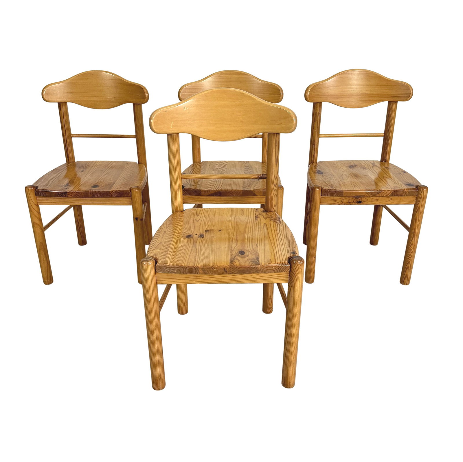 (4) RAINED DAUMILLER PINE DINING CHAIRS: Dimensions: H 35” x W 18.5” x SD 16.7” x SH 18.3”. Set of 4 Vintage pine dining chairs, designed by Rainer Daumiller for Hirtshals Savvaerk in the 1970s.