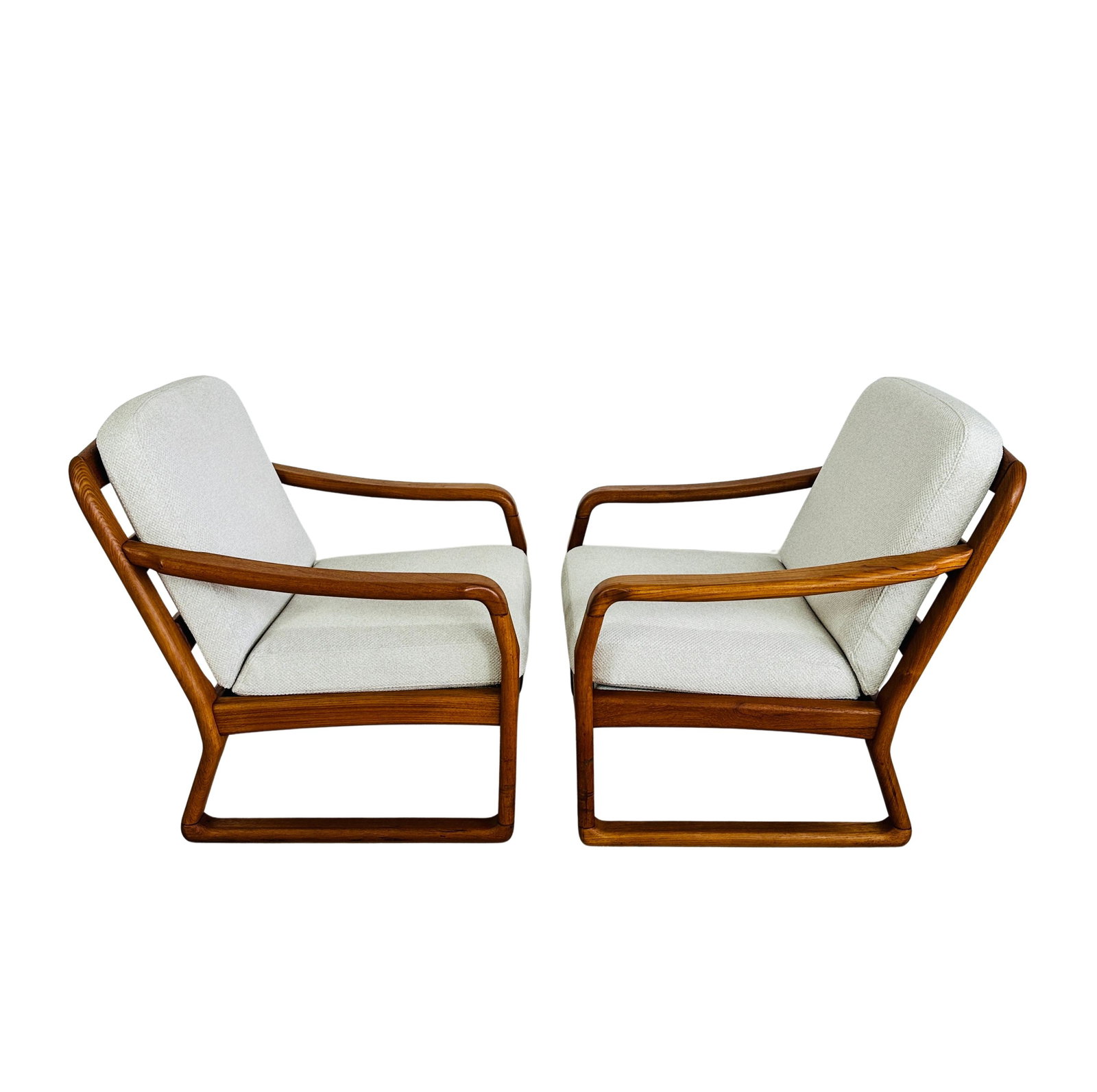 LOUNGE CHAIRS ATTR. TO SILKEBORG MOBELFABRIK, A PAIR: Dimensions: H 31” x W 28.5” x D 27” x SH 17.3”. Pair of Vintage teak lounge chairs attr. to Silkeborg Mobelfabrik with newly upholstered cushions.
