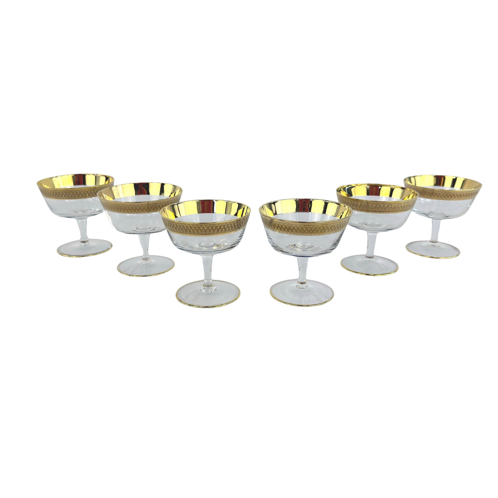 (6) CRYSTAL CHAMPAGNE GLASSES ATTR TOSCA: Dimensions: H 3” x W 3”. Set of 6 Vintage crystal champagne glasses with gold-trimmed rim attr. Lingby Glasvaerk Tosca.