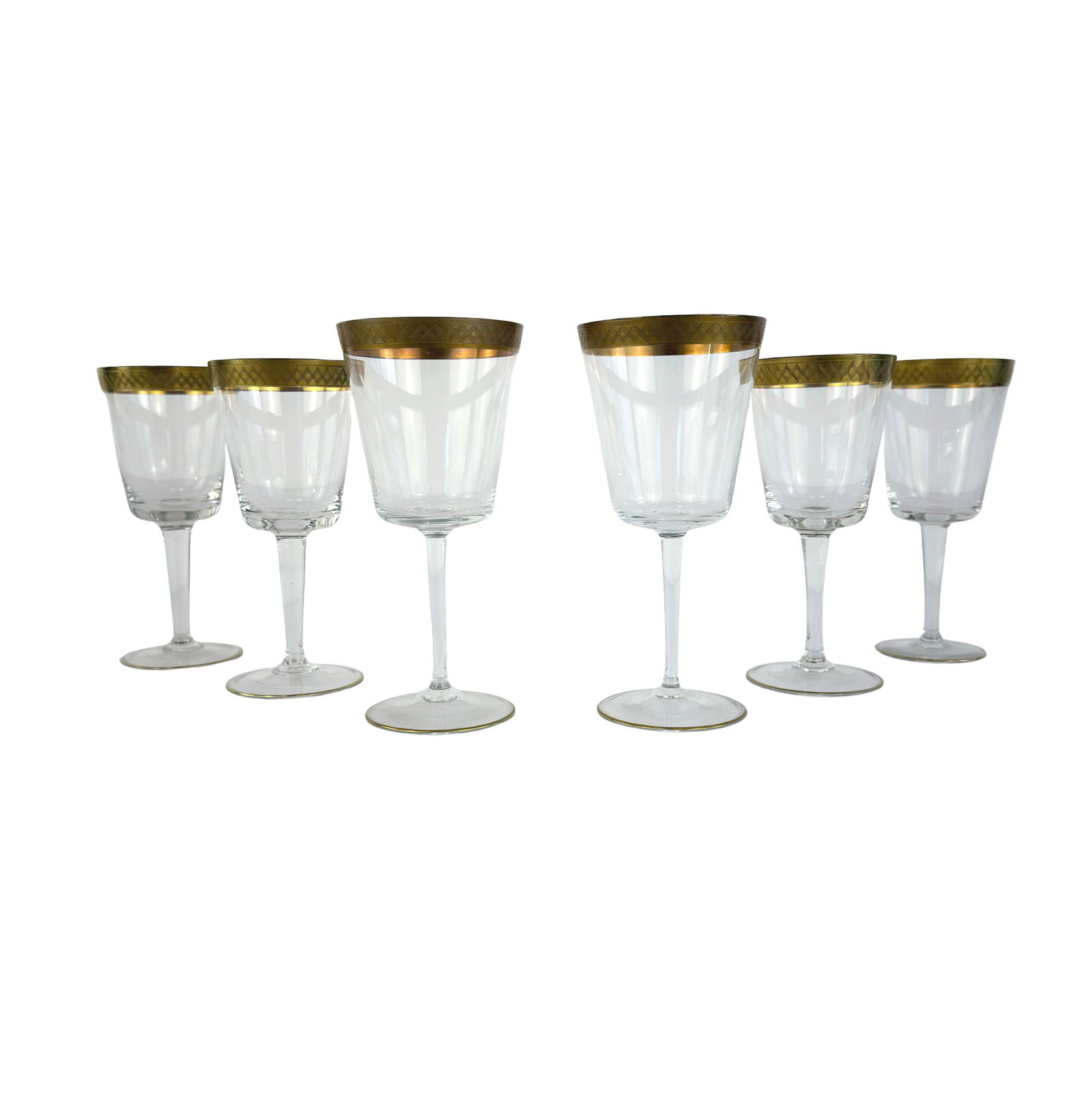 (6) CRYSTAL CHAMPAGNE GLASSES ATTR TOSCA: Dimensions: H 6.7” x W 3”. Set of 6 Vintage crystal champagne glasses with gold-trimmed rim attr. Lingby Glasvaerk Tosca. Dimensions: H 6.3”. Two of the glasses are bigger.