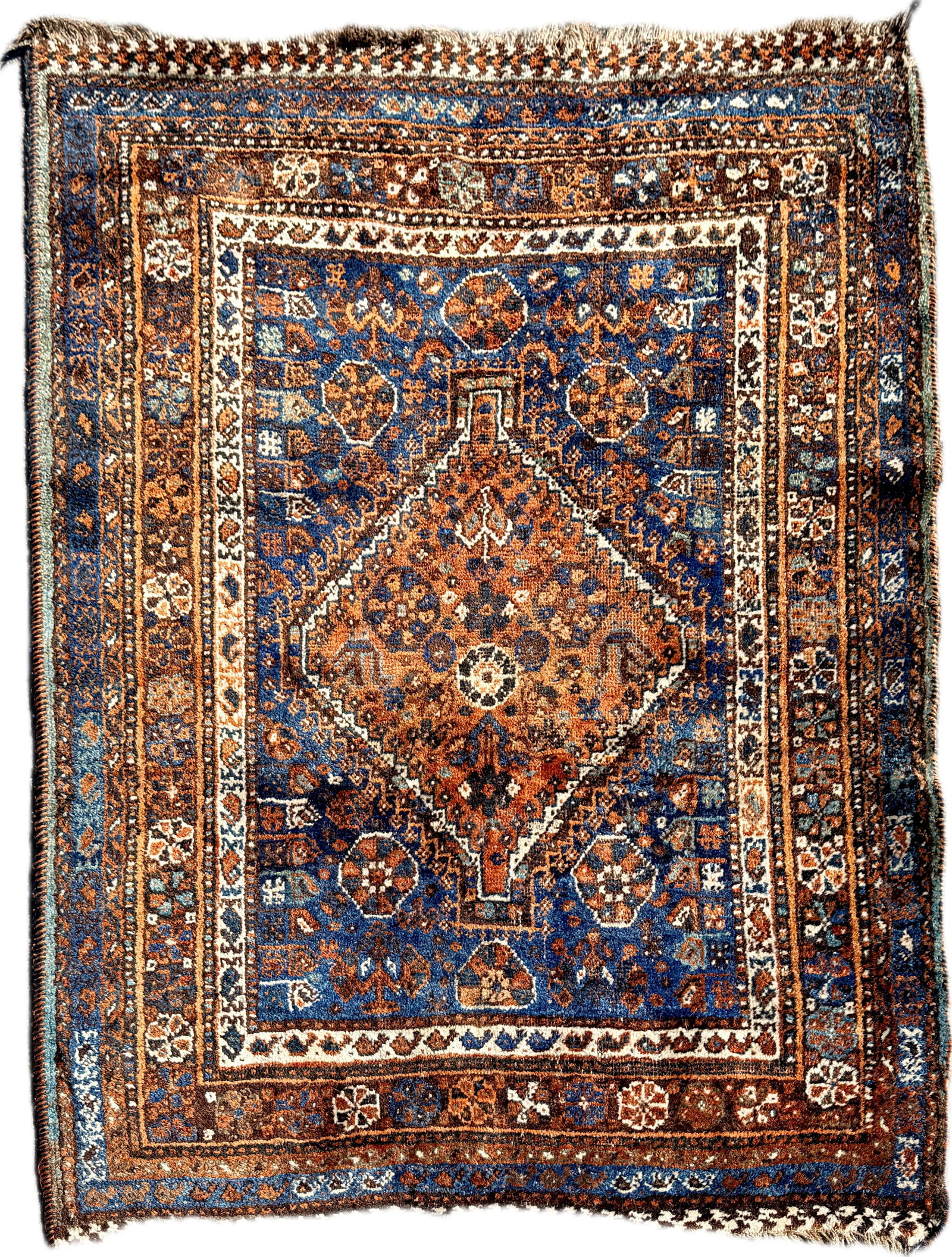 ANTIQUE PERSIAN SHIRAZ WOOL RUG: Dimensions: H 4'9" x W 3'8". Hand-knotted antique Persian Shiraz wool area rug.