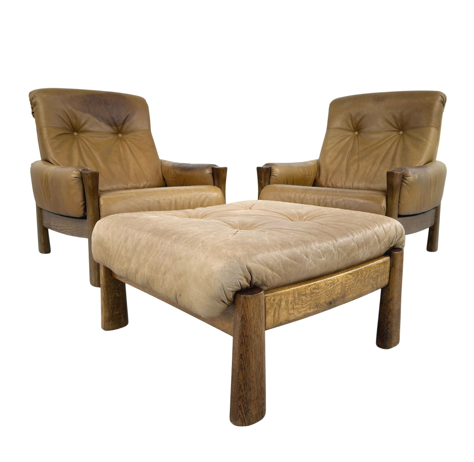 BRUTALIST LEATHER LOUNGE CHAIRS WITH OTTOMAN, A PAIR, 1970s: Dimensions: H 33.4” x W 29.5” x D 33". Pair of Vintage Brutalist oak light brown leather high back lounge chairs with matching ottoman, 1970s. Dimensions: (ottoman) H 16.5" x W 26".
