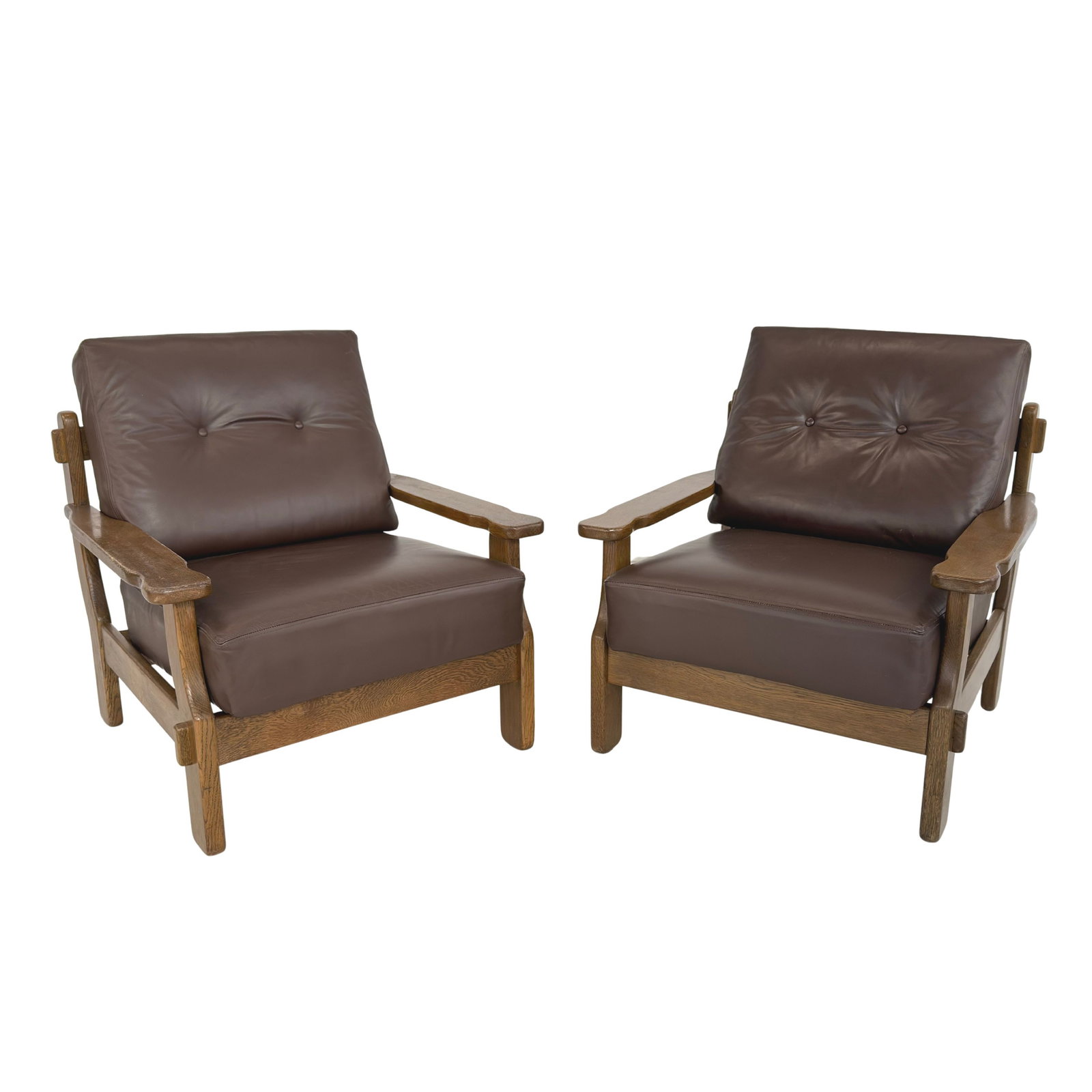 BRUTALIST LEATHER ARMCHAIRS, A PAIR: Dimensions: H 34” x W 31” x D 33” x SH 18”. Pair of Vintage Brutalist oak dark brown leather armchairs with loose padded cushions.