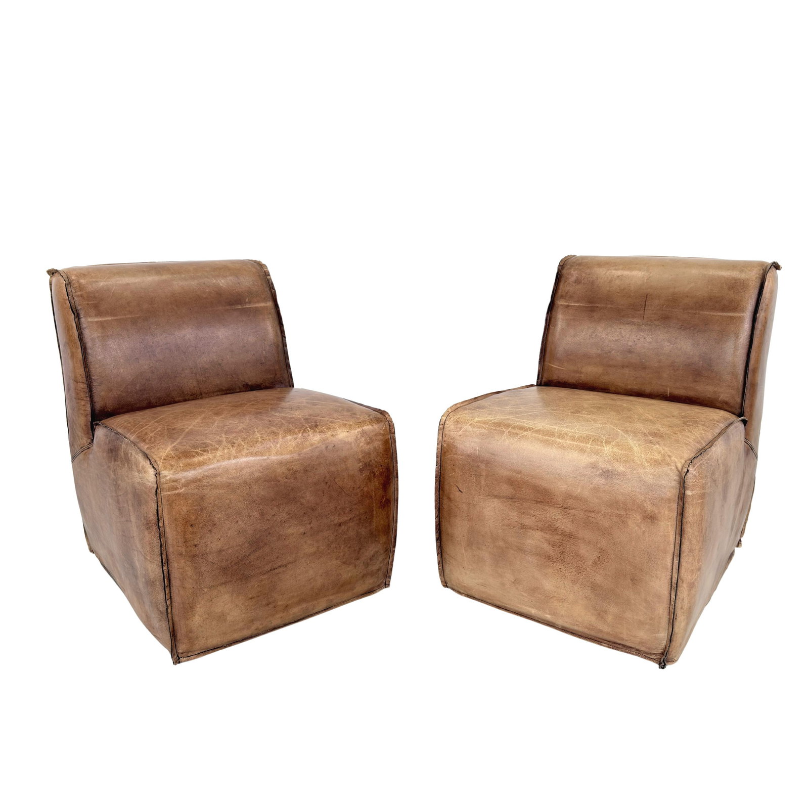 BRUNO LEATHER LOUNGE CHAIRS, A PAIR: Dimensions: H 33” x W 23.5” x D 29.5” x SH 20”. Pair of Vintage Bruno brown leather lounge chairs from Restoration Hardware