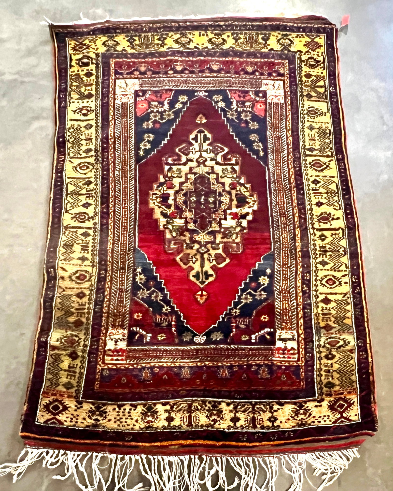 VINTAGE TURKISH WOOL RUG: Dimensions: H 6'5" x W 3'8". Vintage Turkish wool rug with geometric design.