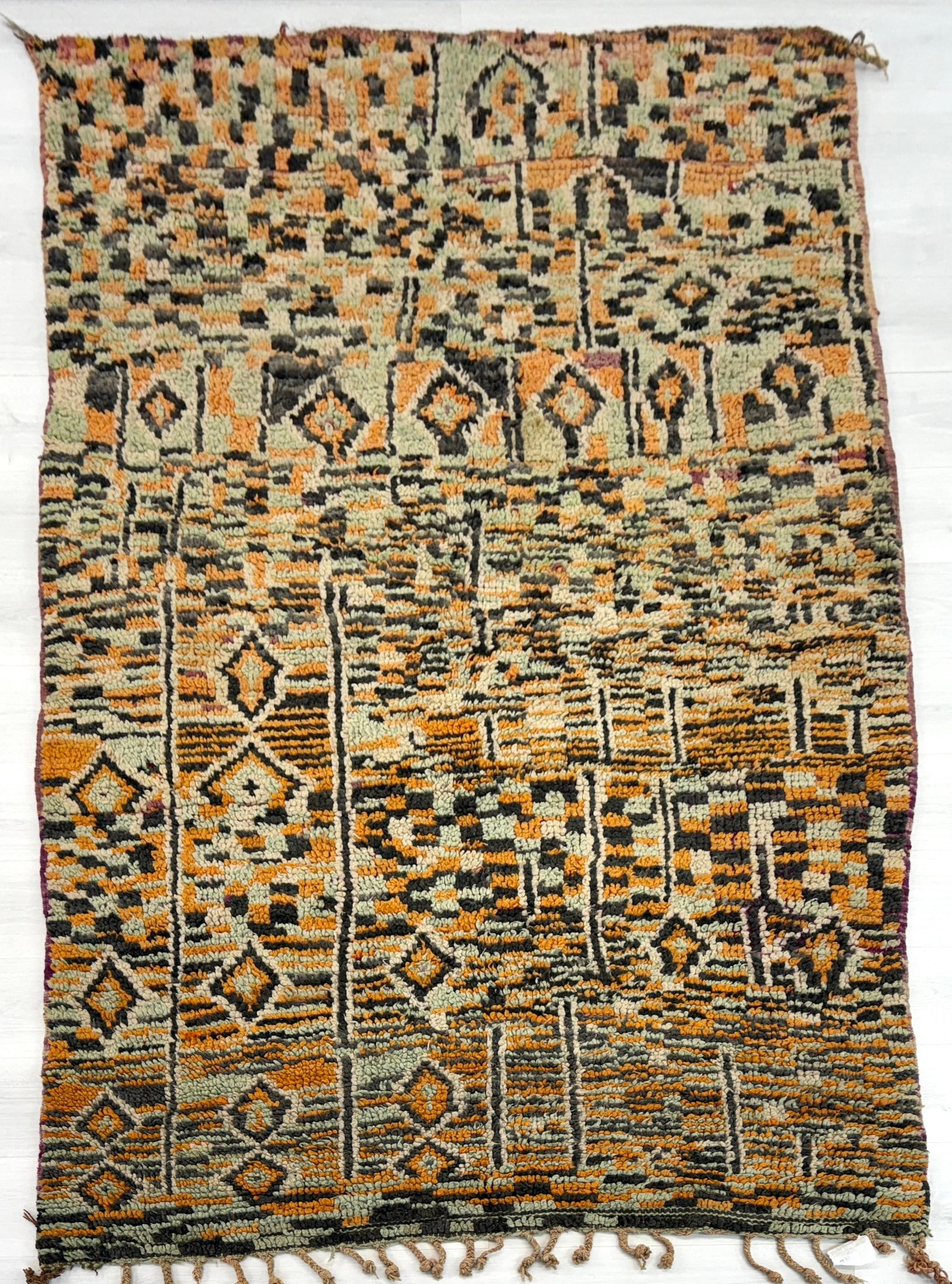 ART DECO HAND-KNOTTED WOOL RUG: Dimensions" H 7'10" x W 4'9". Berber wool flatweave rug with geometric design.