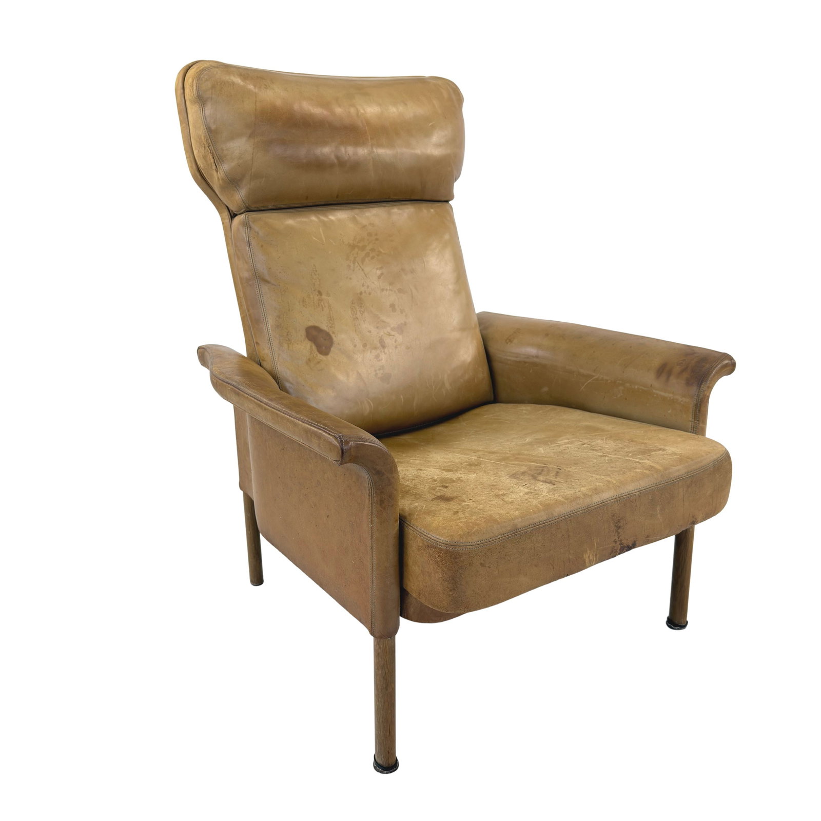 LOUNGE CHAIR MANNER OF HANS OLSEN: Dimensions: H 39.5” x W 31” x D 34” x SH 15”. Vintage cognac leather high back lounge chair manner of Hans Olsen, 1960s.