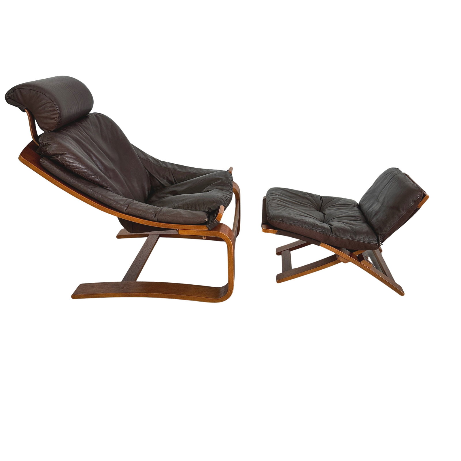 AKE FRIBYTTER KROKEN CHAIR WITH OTTOMAN: Dimensions: H 35 ” x W 30.5” x D 37” x SH 17”. Vintage brown leather Kroken chair with ottoman designed by Ake Fribytter for Nelo Mobel with cantilever wood frame. Dimensions: 