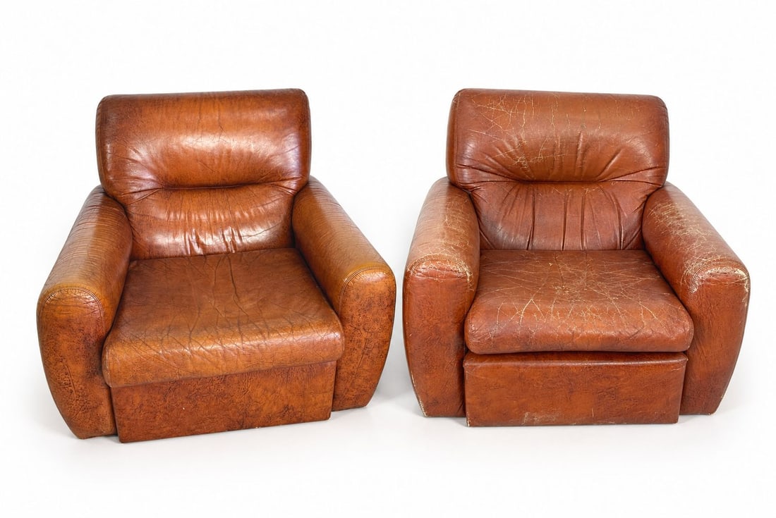 ITALIAN LEATHER LOUNGE CHAIRS, A PAIR: Dimensions: H 29 ” x W 34” x D 34.5” x SH 14”. Pair of Vintage Italian brown leather lounge chairs from the 1960s. Manifattura Italiana. Dimensions: (2nd chair) H 29" x W