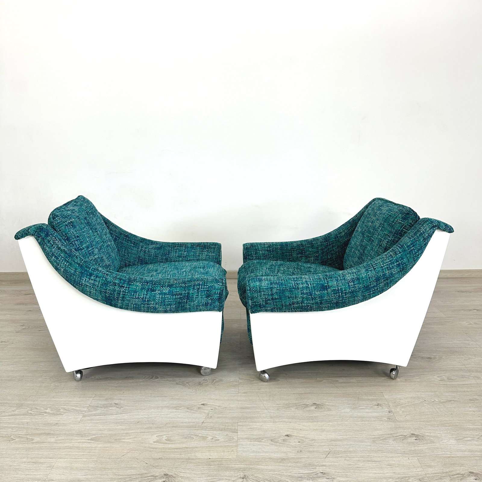ITALIAN SPACE AGE LOUNGE CHAIRS, A PAIR: Dimensions: H 28” x W 30.5” x D 32” x SH 17.3”. Pair of Vintage Italian Space Age lounge chairs with white frame, newly upholstered in blue textured fabric.