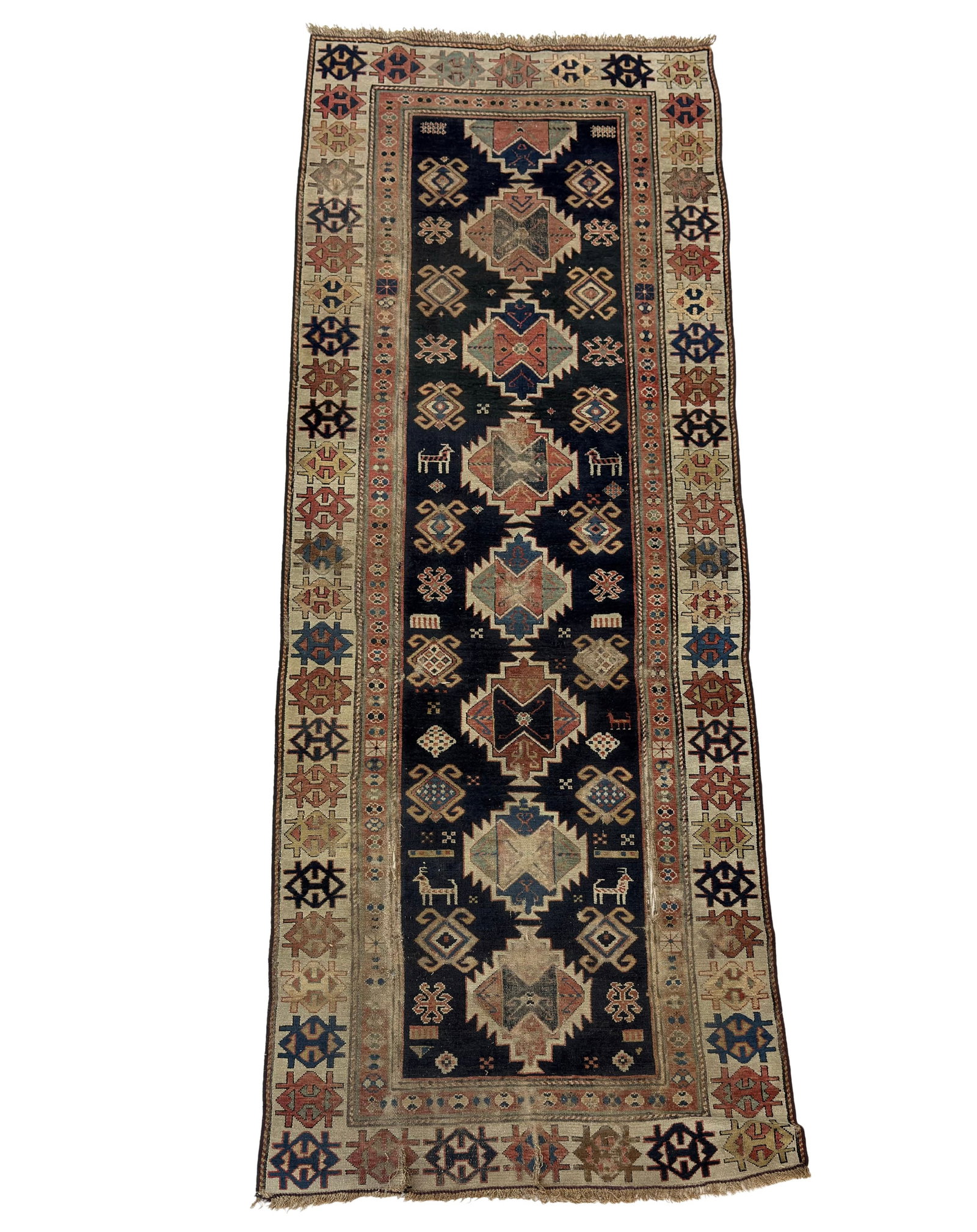 ANTIQUE KAZAK RUNNER RUG: Dimensions: H 9'6" x W 3'4". Antique Kazak runner rug with geometric design.