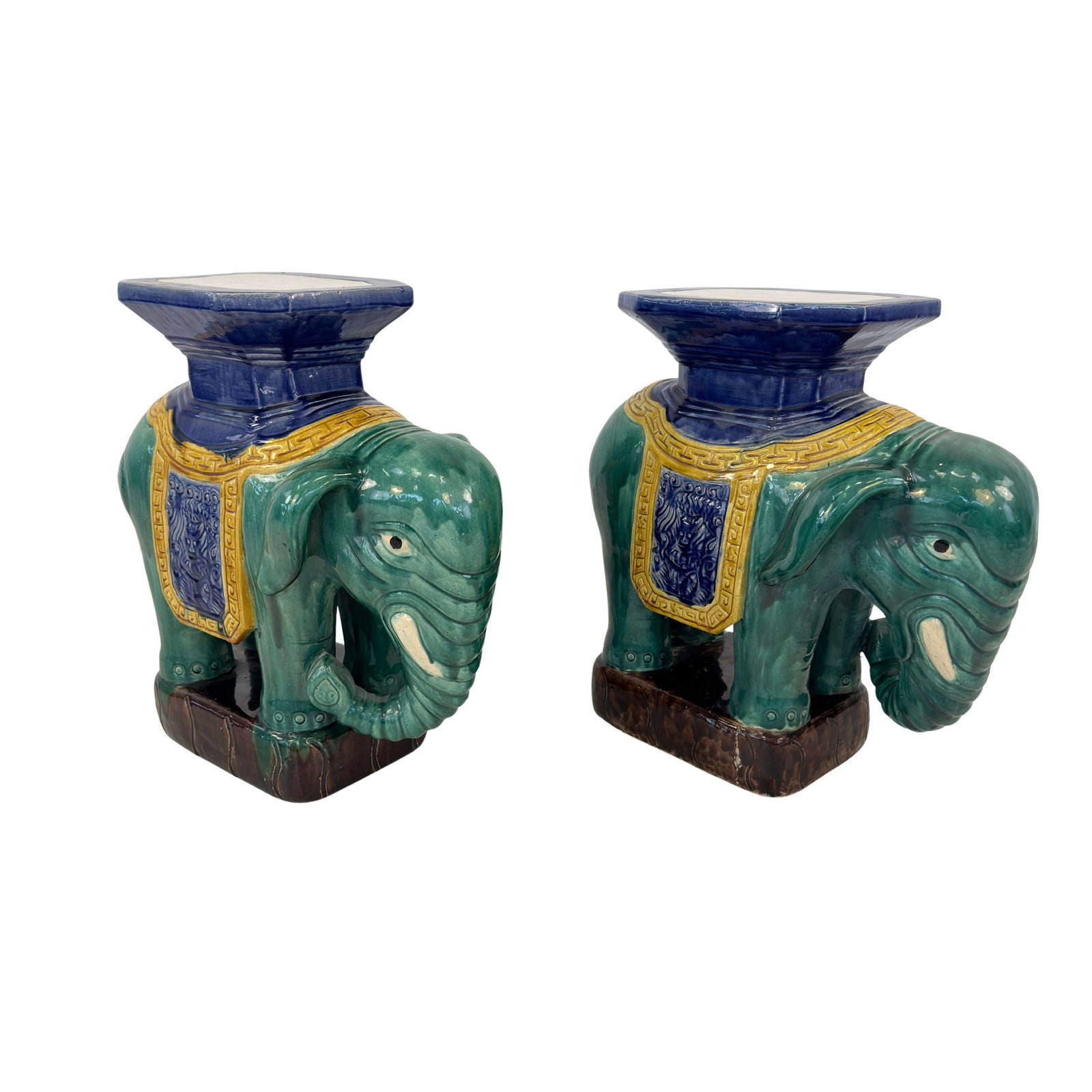CERAMIC ELEPHANT PLANT STANDS, A PAIR: Dimensions: H 22.5” x W 21” x D 9.5”. Pair of Vintage Chinese hand painted ceramic Elephant pedestals / plant stands, made in Hong Kong. Marked.