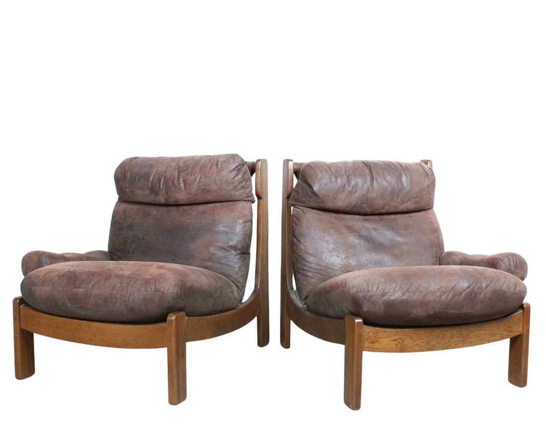 BRUTALIST LOUNGE CHAIRS, A PAIR: Dimensions: H 36.6” x W 63 ” x D 35.8” x SH 17.7”. Pair of Brutalist lounge chairs/modular sofa in dark brown suede on wooden frame. Two-part design with one armrest each. Widt