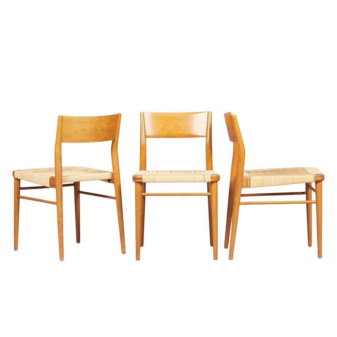(3) DINING CHAIRS BY GEORG LEOWALD,1960s: Dimensions: H 30.5” x W 18.7” x D 20.8” x SH 18.3”. Set of 3 German dining chairs by Georg Leowald for Wilkhahn with cherry wood frame and rattan weave seats.