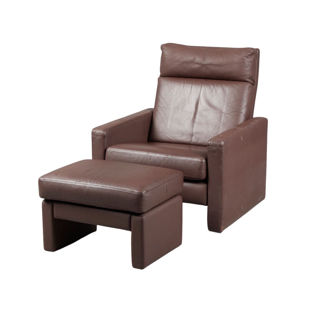 COR CONSETA LOUNGE CHAIR WITH OTTOMAN, 1964: Dimensions: H 36.6” x W 32.2” x D 34.2” x SH 16.5”. Vintage German high-back lounge chair with ottoman model “Conseta” by COR in dark brown leather, designed in the 196