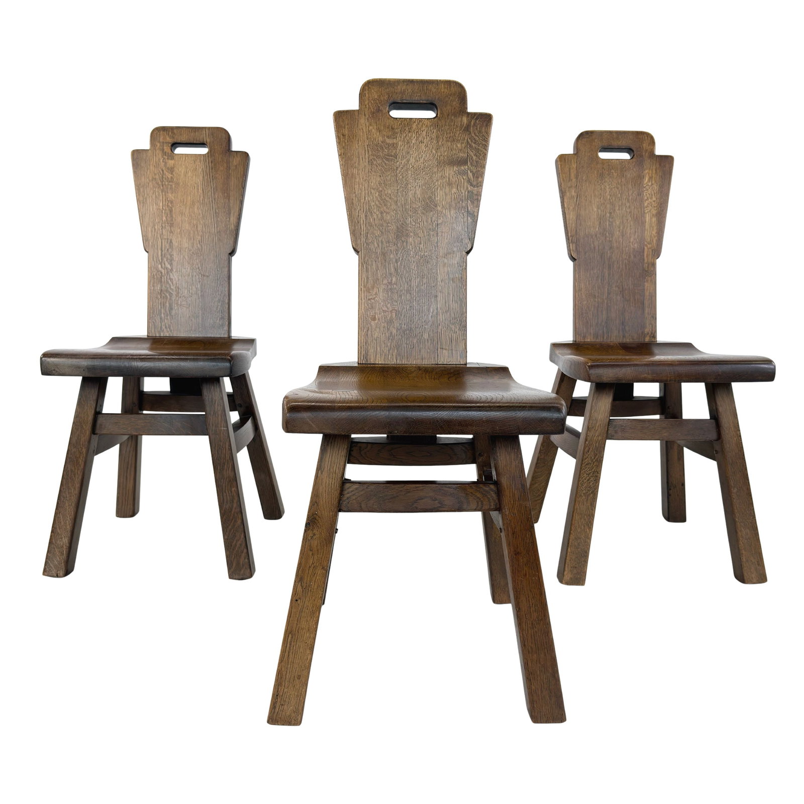 (3) BELGIAN BRUTALIST DINING CHAIRS: Dimensions: H 37.5” x W 15” x D 19.7” x SH 18”. Set of 3 Belgian Brutalist oak dining chairs with geometric backrests from the 1970s.