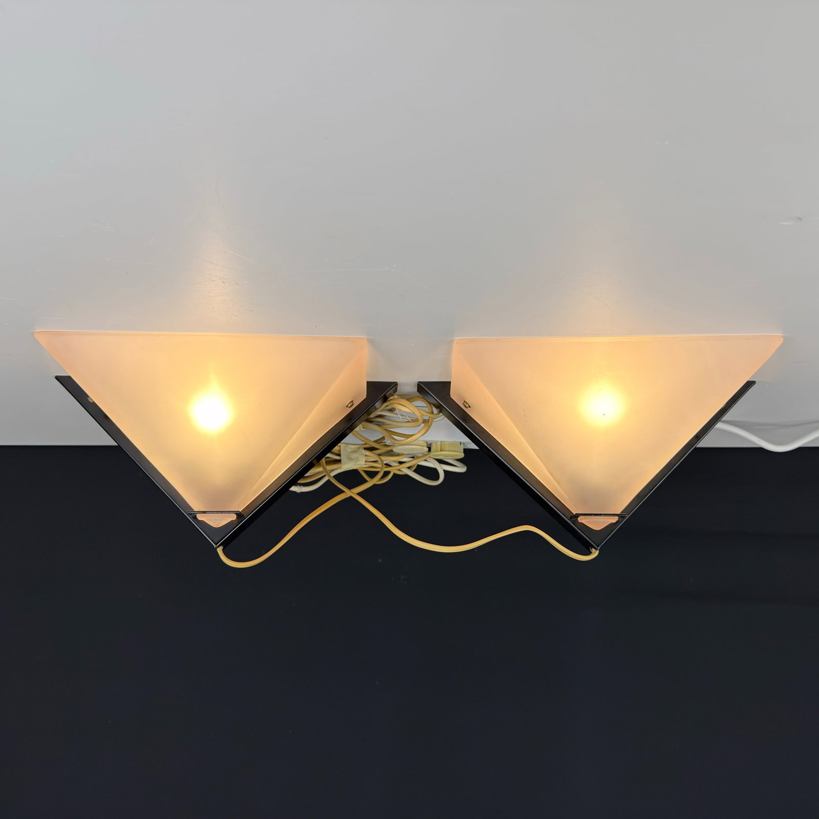 FOKKE DIJKSTRA WALL SCONES, A PAIR: Dimensions: W 13” x D 6.7”. Pair of Dutch wall sconces model Zucca by FOKKE Dijkstra with frosted glass shades.