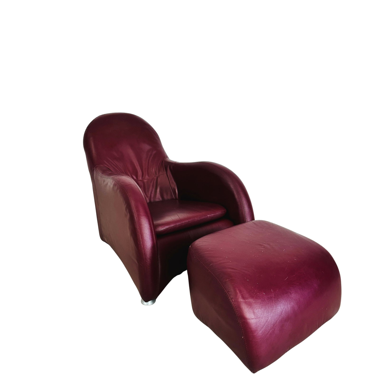MONTIS LOGE ARMCHAIR WITH OTTOMAN: Dimensions: H 33” x W 28.7” x D 38” x SH 14.7”. Vintage dark red leather Montis Loge armchair with ottoman designed by Gerard Van Den Berg in the 1980s.