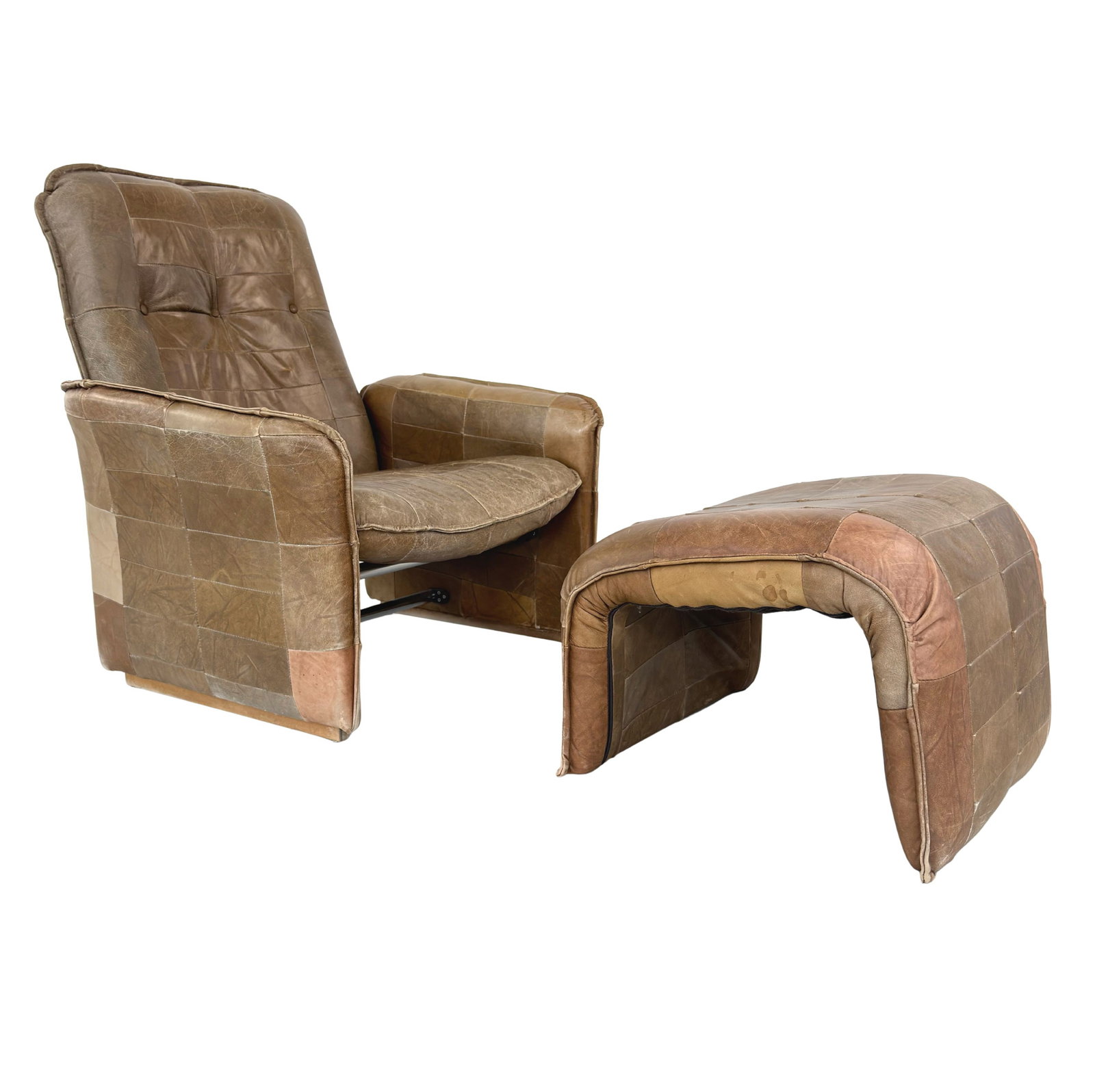 RECLINER CHAIR WITH OTTOMAN MANNER OF DE SEDE: Dimensions: H 37.7” x W 32” x D 32” x SH 16”. Vintage brown leather patchwork recliner chair with ottoman manner of De Sede. Dimensions: (ottoman) H 16.5” x W 23.3”