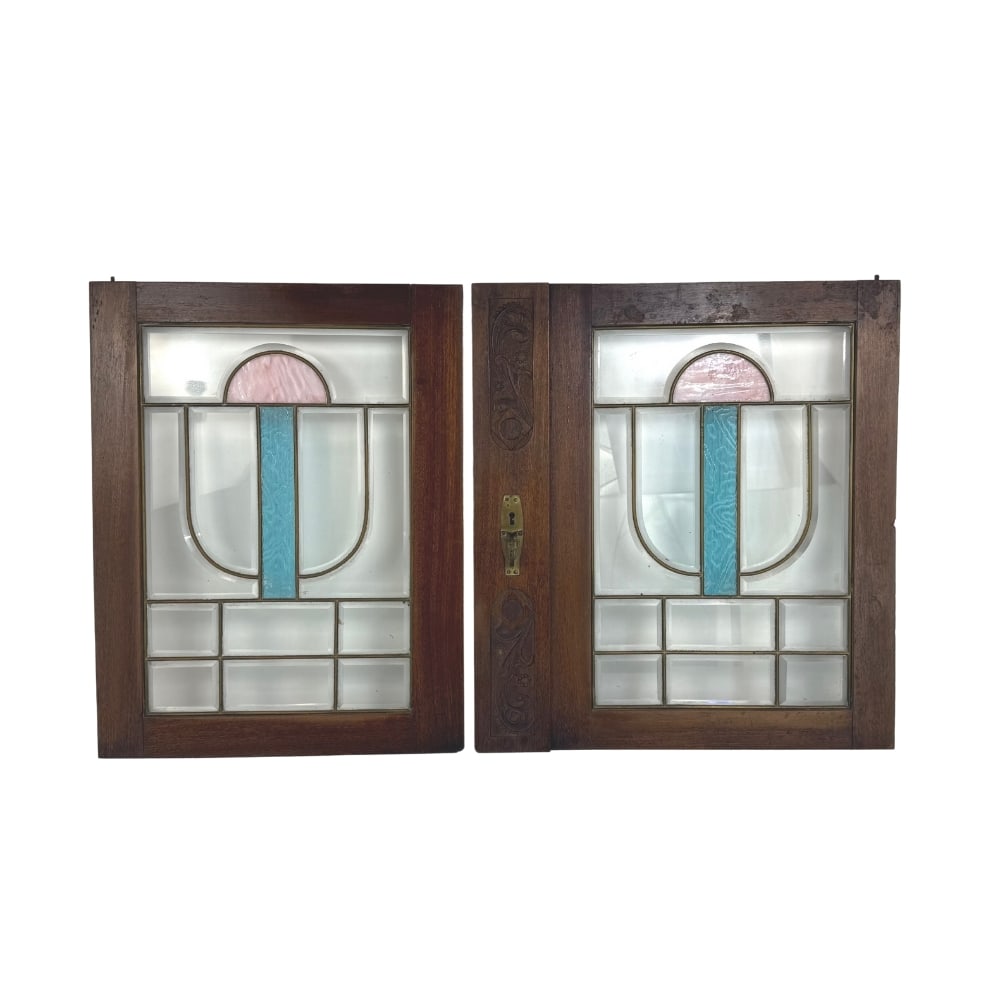 (2) STAINED GLASS DOORS: Dimensions: H 21.3” x W 19.3”. Pair of wooden doors with stained glass panels. Dimensions: H 21.3” x W 16.5”.