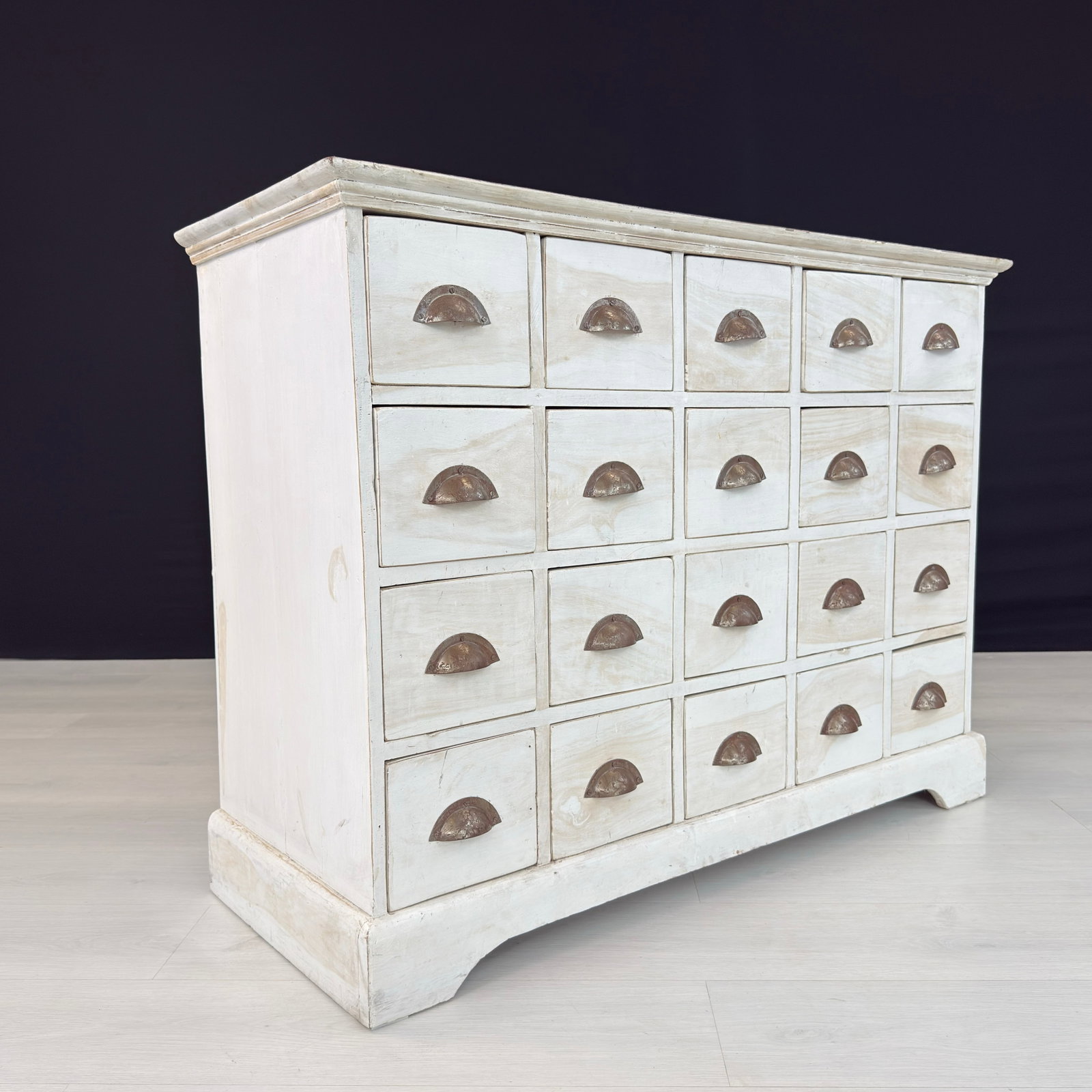 VINTAGE APOTHECARY CHEST OF DRAWERS: Dimensions: H 33” x W 44” x D 17.3”. Vintage French Apothecary chest of drawers with 20 small drawers with cast iron handles.