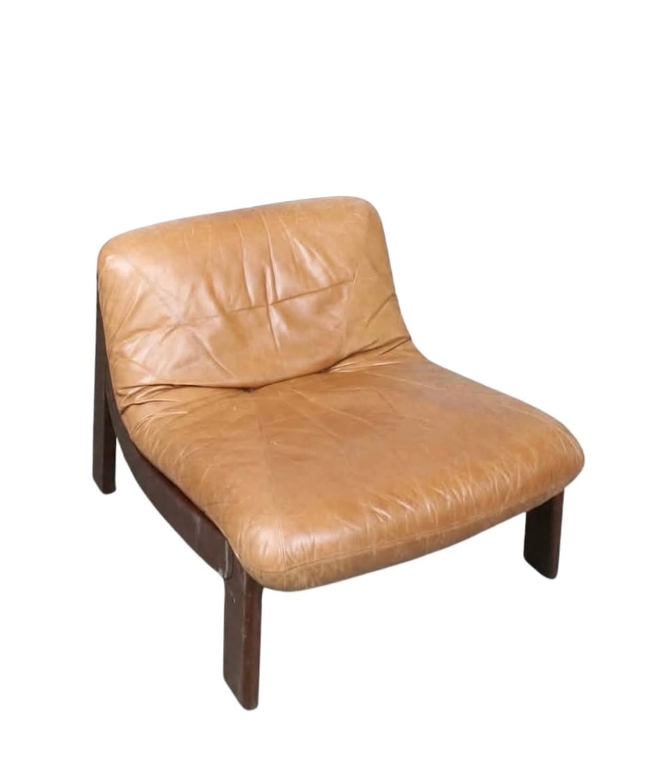 GERMAN LOUNGE CHAIR MANNER OF CARL STRAUB: Dimensions: H 26.3” x W 31.4” x D 35.4” x SH 14.5”. Vintage German oak lounge chair manner of Carl Straub with brown leather loose padded cushion.
