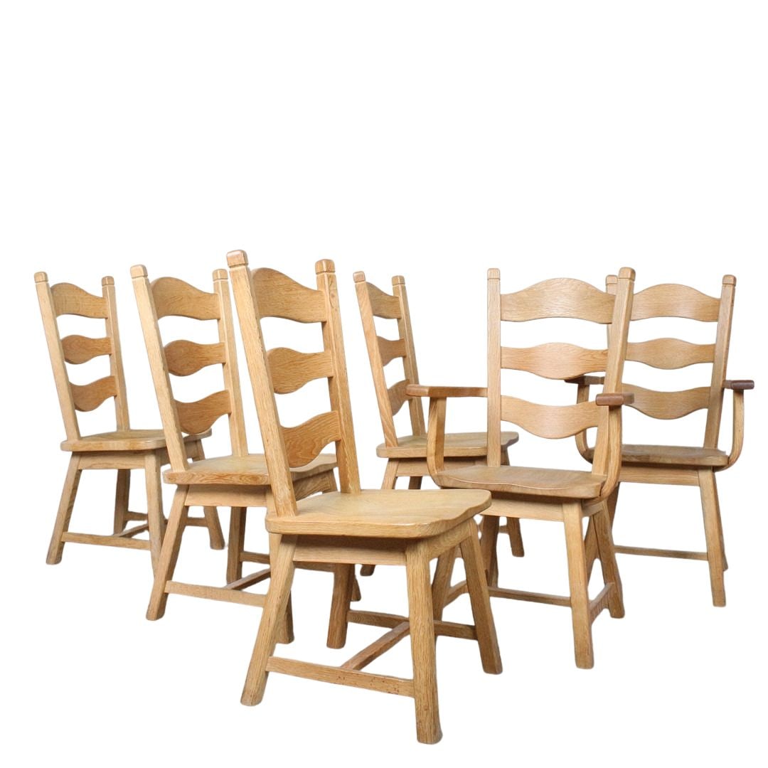 (6) BRUTALIST RAZORBLADE DINING CHAIRS, 1970s: Dimensions: H 40.9” x W 18.1” x D 21.6” x SH 18.1”. Set of 6 Vintage Brutalist Razorblade oak dining chairs, two of the chairs are with armrests. Dimensions: H 40.9” x W