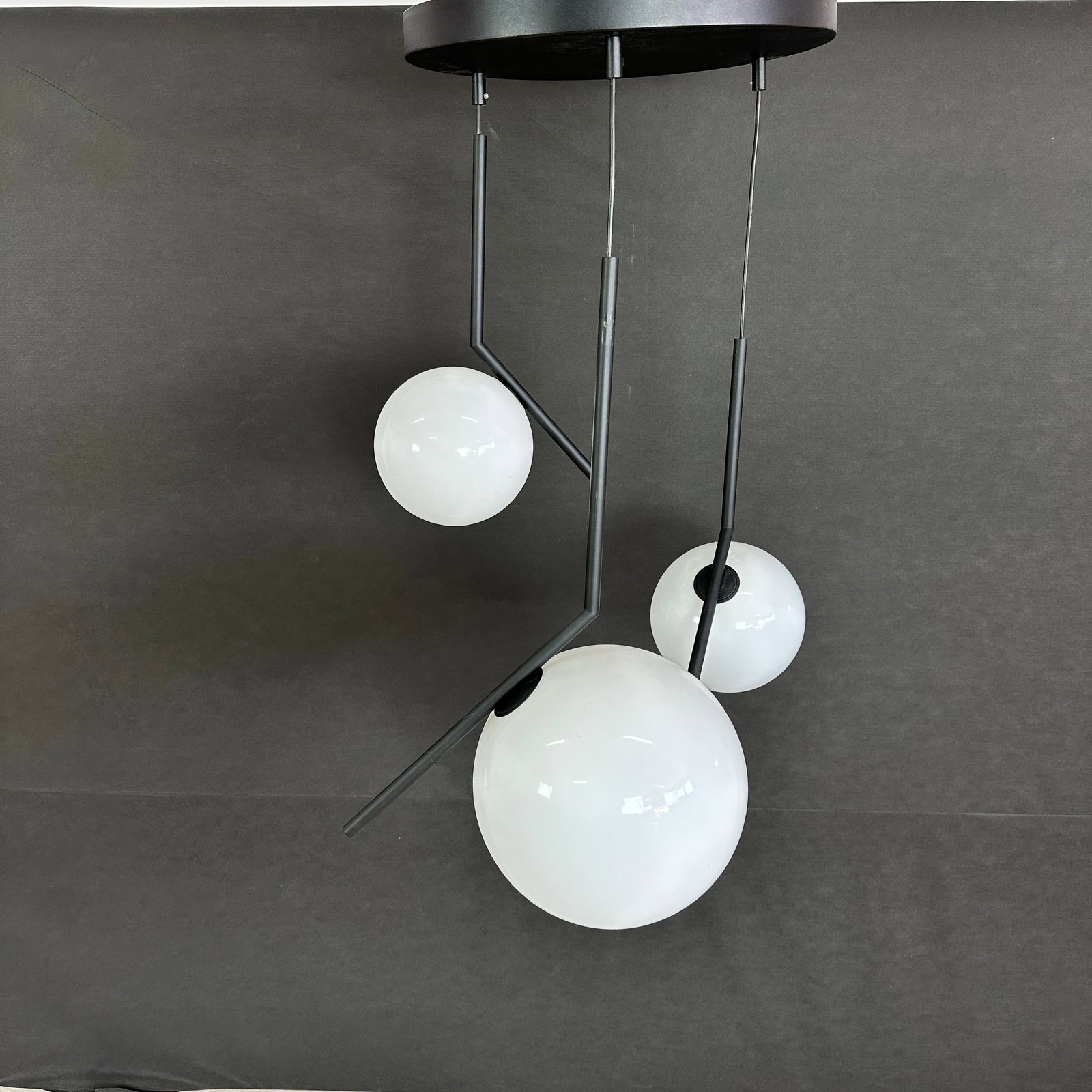 MONROE PENDANT LIGHT: Dimensions: H 35.5” x W 21”. Vintage Monroe three-light pendant lamp with black metallic rods.