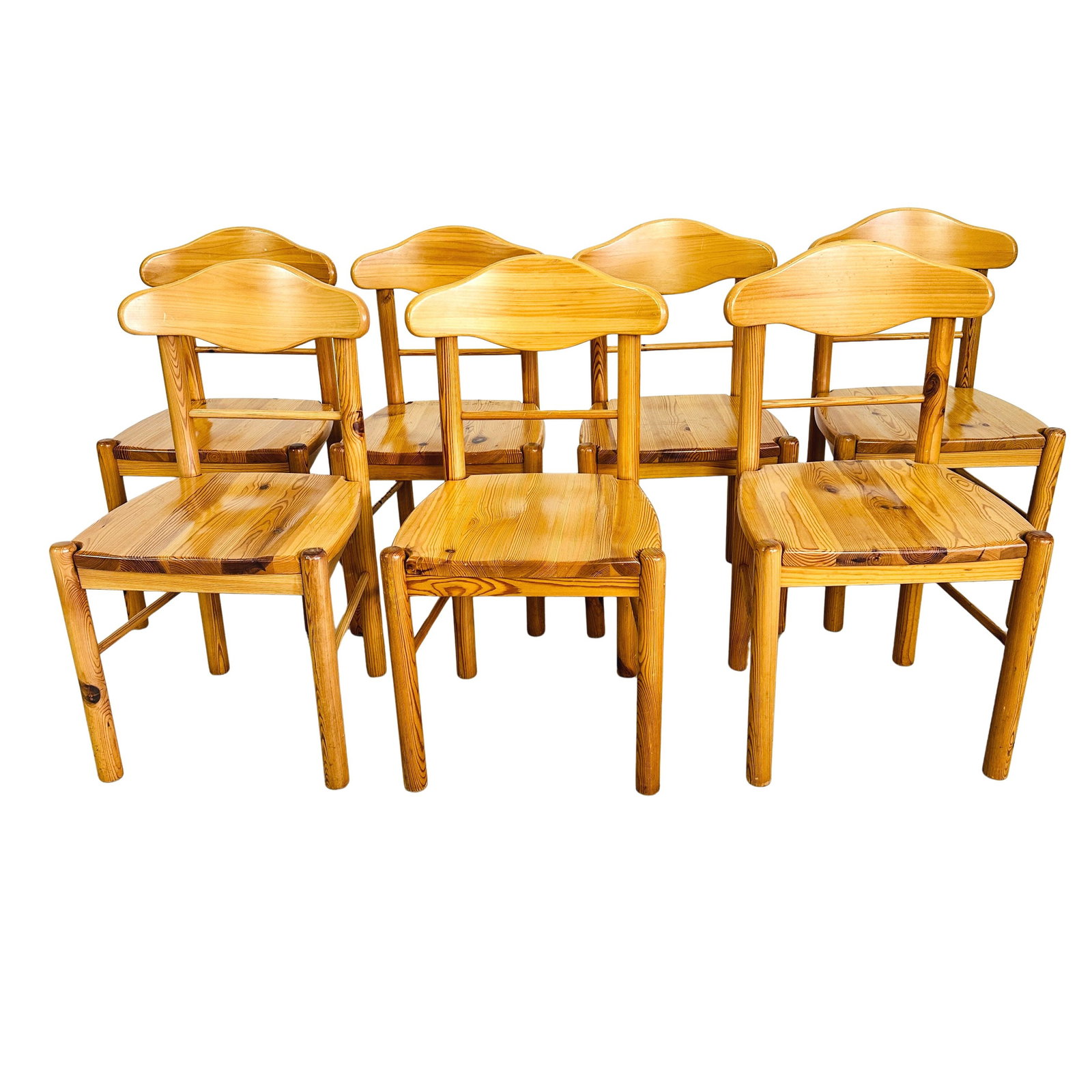 (7) PINE DINING CHAIRS ATTR. RAINER DAUMILLER: Dimensions: H 35” x W 18.5” x SD 18” x SH 18.5”. Set of 7 Brutalist dining chairs in solid pine attr. to Rainer Daumiller, crafted in the 1970s.