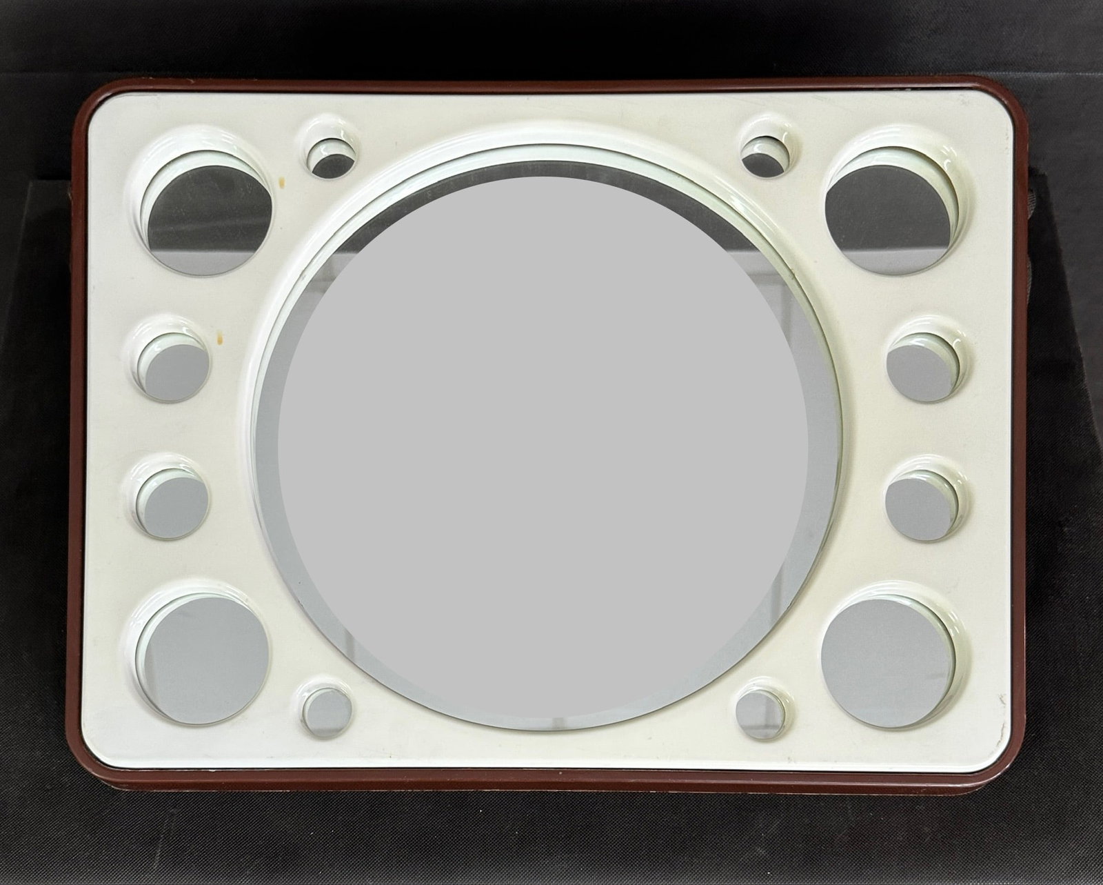VINTAGE PLANET MIRROR, 1970s: Dimensions: H 15.7" x W 21". Vintage Space Age planet wall mirror with white plastic white frame.