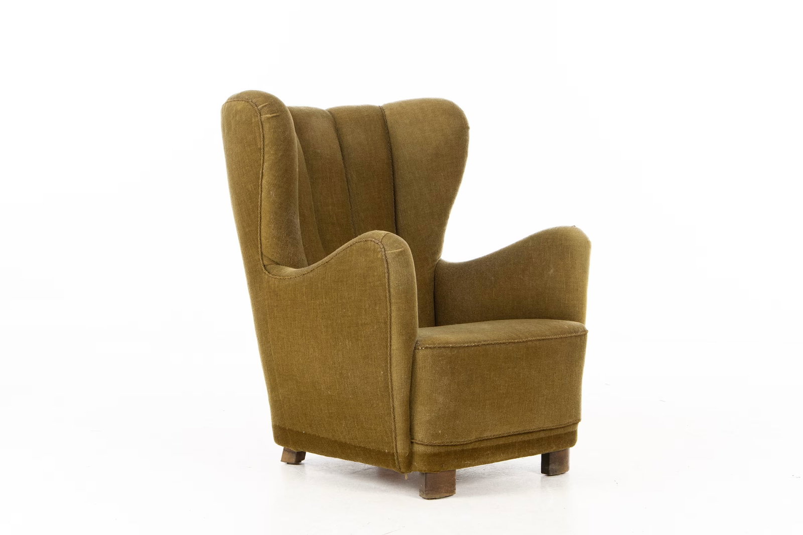 DANISH LOUNGE CHAIR ATTR. TO SLAGELSE MOBELVAERK: Dimensions: H 38” x W 31” x D 34”. Large Danish lounge chair with channel back in green mohar attr. to Slagelse Mobelvaerk, 1940's. 0646