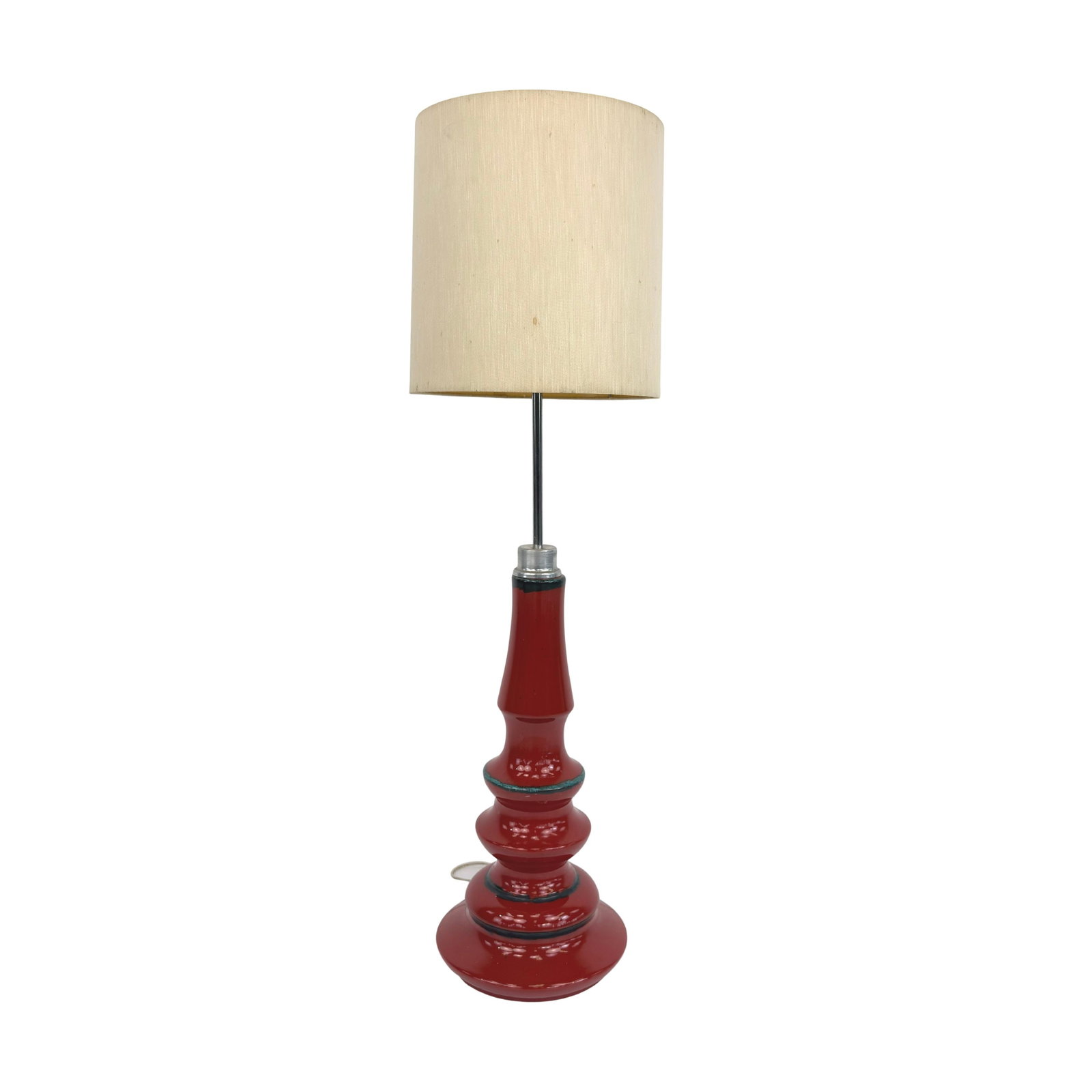 VINTAGE GERMAN TABLE LAMP: Dimensions: H 32” x W 10”. Vintage German table/floor lamp with red ceramic base and beige fabric lampshade.