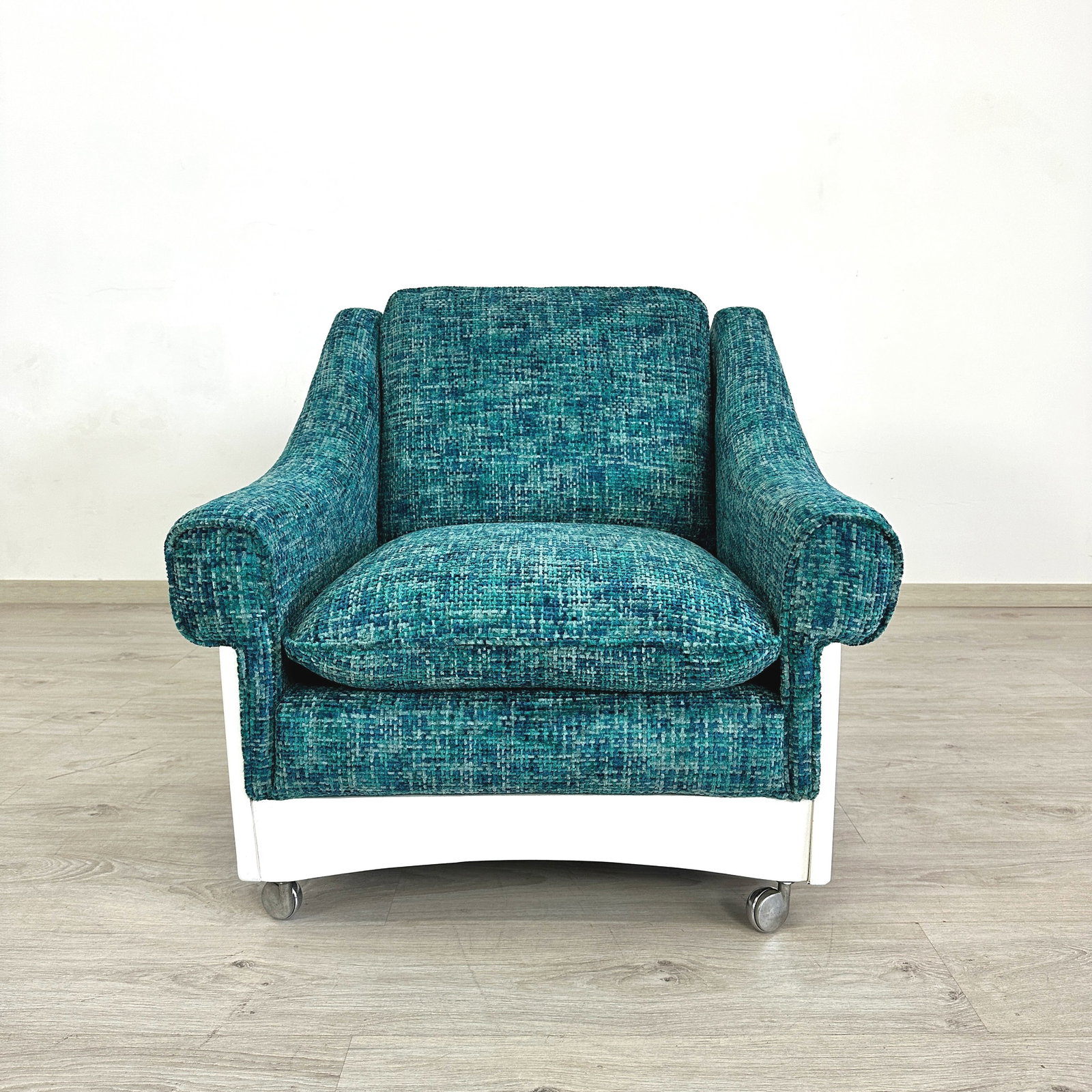 ITALIAN SPACE AGE LOUNGE CHAIR: Dimensions: H 28” x W 30.5” x D 32” x SH 17.3”. Vintage Italian Space Age lounge chair with white frame, newly upholstered in blue textured fabric.