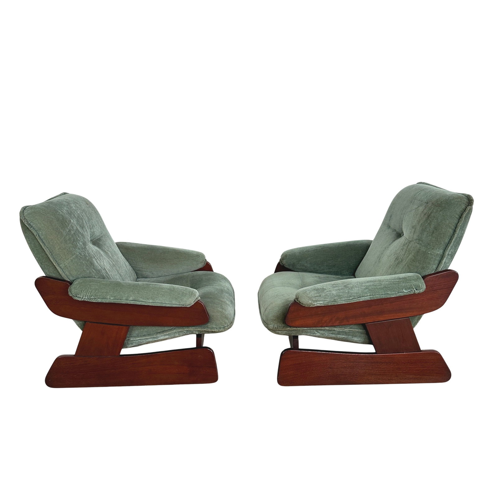 ITALIAN BRUTALIST LOUNGE CHAIRS, A PAIR: Dimensions: H 34 ” x W 33 ” x D 34 ” x SH 16”. Pair of Italian Brutalist lounge chairs with dark wood frames and light green/blue velvet fabric cushions.