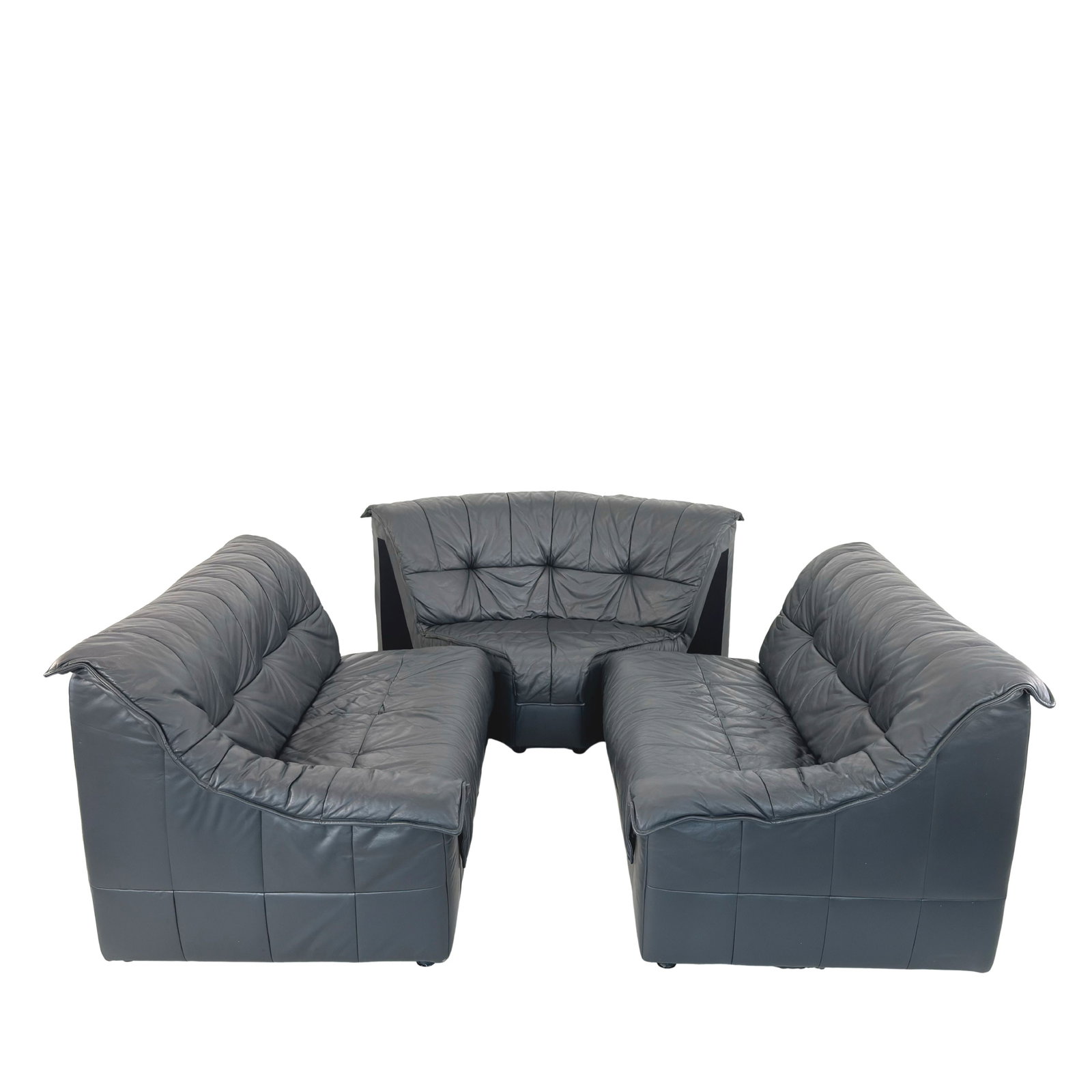 MODULAR SOFA MANNER OF DE SEDE: Dimensions: H 34” x W 53.5” x D 38.5” x SH 18”. Vintage dark gray leather modular sofa manner of De Sede, consist of 3 modules – two sofas, each one with one armrest and